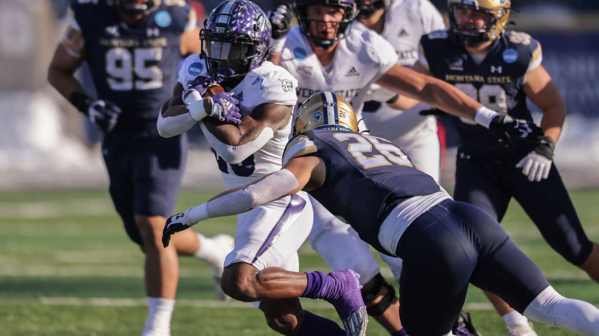Weber State running back Dontae McMillan (28) runs the ball in a 2nd round playoff game that the Wildcats lost to Montana State 33-25 on Dec. 3, 2022.