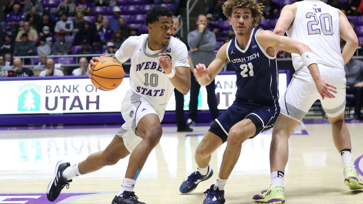 Weber State guard Keith Dinwiddie (10) drives with the basketball in a game the Wildcats lost to Utah Tech, 77-65, on Dec. 3, 2022.
