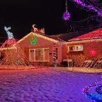 Millcreek man lights up neighborhood with the face of Santa