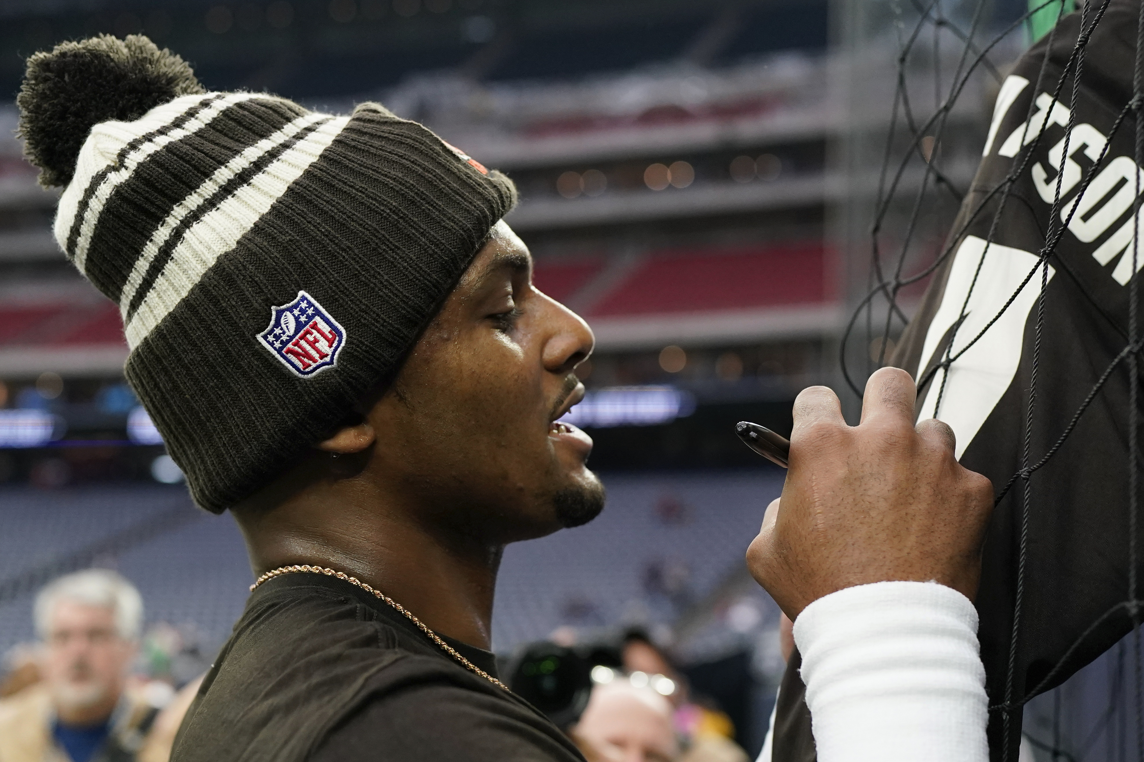 Cleveland Browns quarterback Deshaun Watson signs autographs before of an NFL football game between the Cleveland Browns and Houston Texans in Houston, Sunday, Dec. 4, 2022,. 