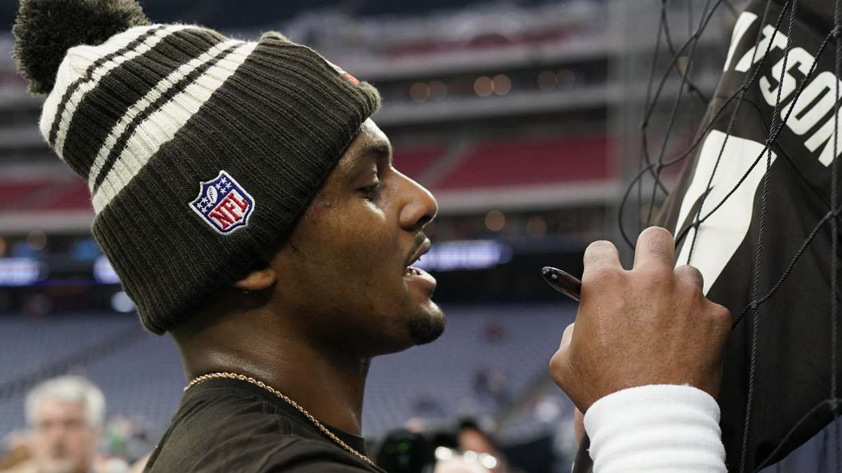 Cleveland Browns quarterback Deshaun Watson signs autographs before of an NFL football game between the Cleveland Browns and Houston Texans in Houston, Sunday, Dec. 4, 2022,.