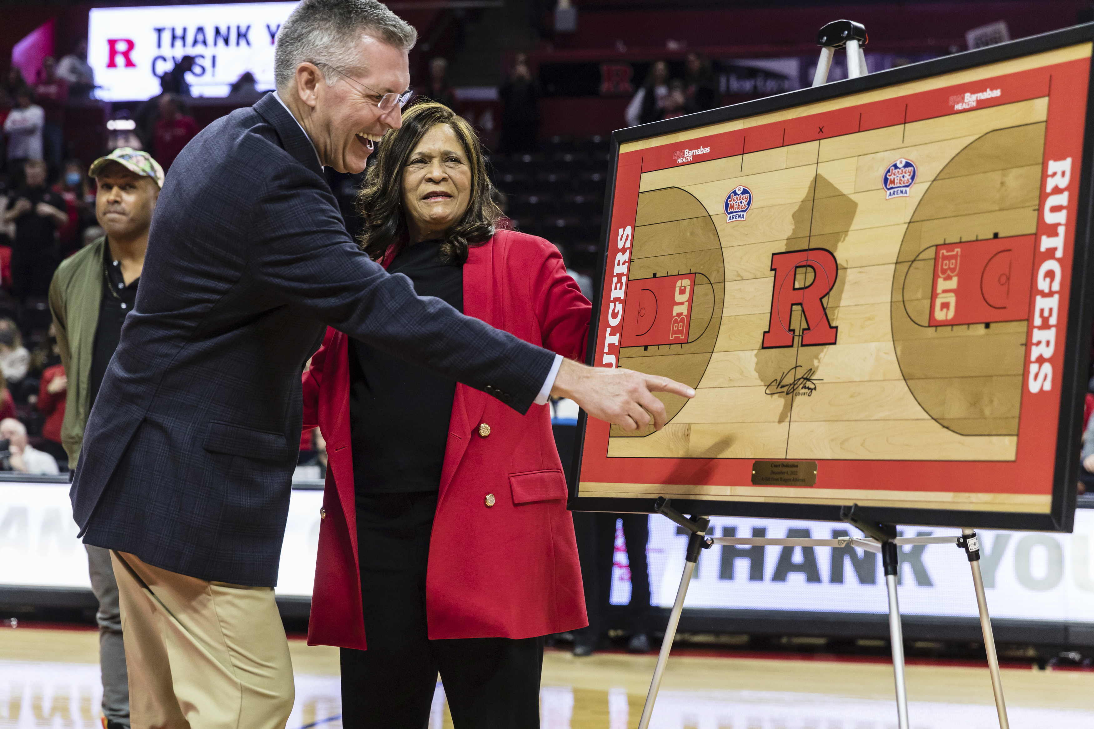 Director of Athletics at Rutgers University, Pat Hobbs, left, with former Rutgers head coach, C. Vivian Stringer, at a ceremony held in her honor during half time at the Big Ten Conference women's college basketball game between the Rutgers Scarlet Knights and the Ohio State Buckeyes in Piscataway, N.J., Sunday, Dec. 4, 2022. 
