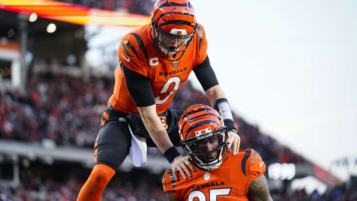 Cincinnati Bengals wide receiver Tee Higgins (85) and quarterback Joe Burrow (9) celebrate a touchdown against the Kansas City Chiefs in the first half of an NFL football game in Cincinnati, Sunday, Dec. 4, 2022.