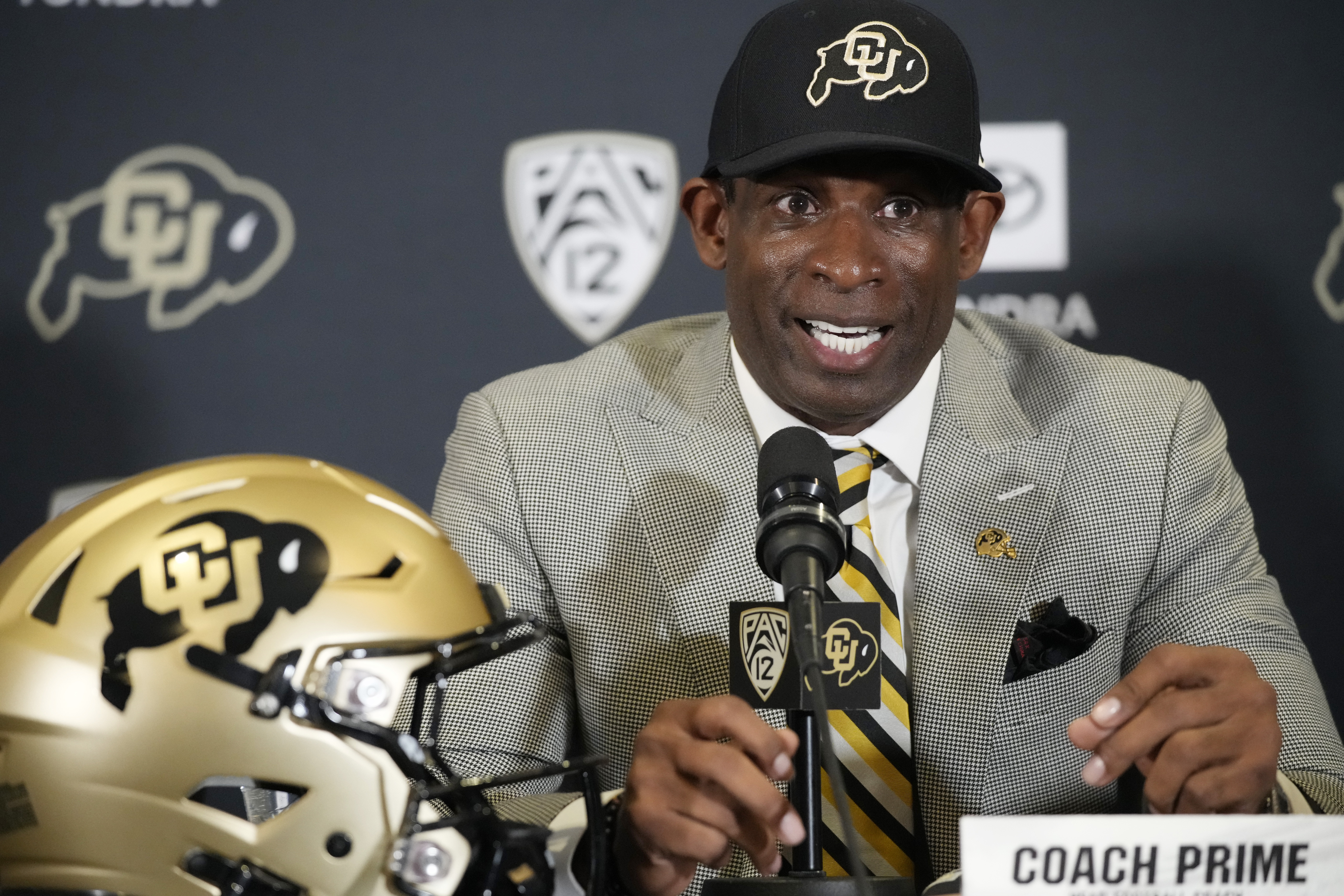 Deion Sanders speaks after being introduced as the new head NCAA college football coach at Colorado during a news conference Sunday, Dec. 4, 2022, in Boulder, Colo. 