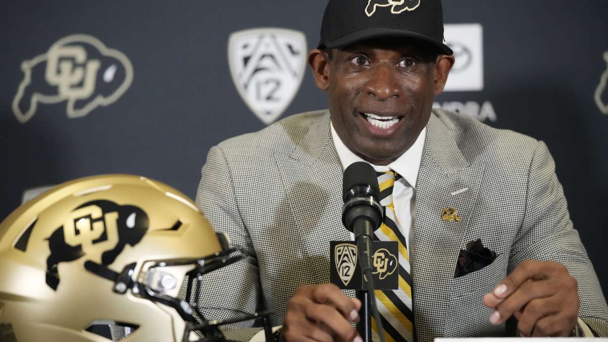 Deion Sanders speaks after being introduced as the new head NCAA college football coach at Colorado during a news conference Sunday, Dec. 4, 2022, in Boulder, Colo.