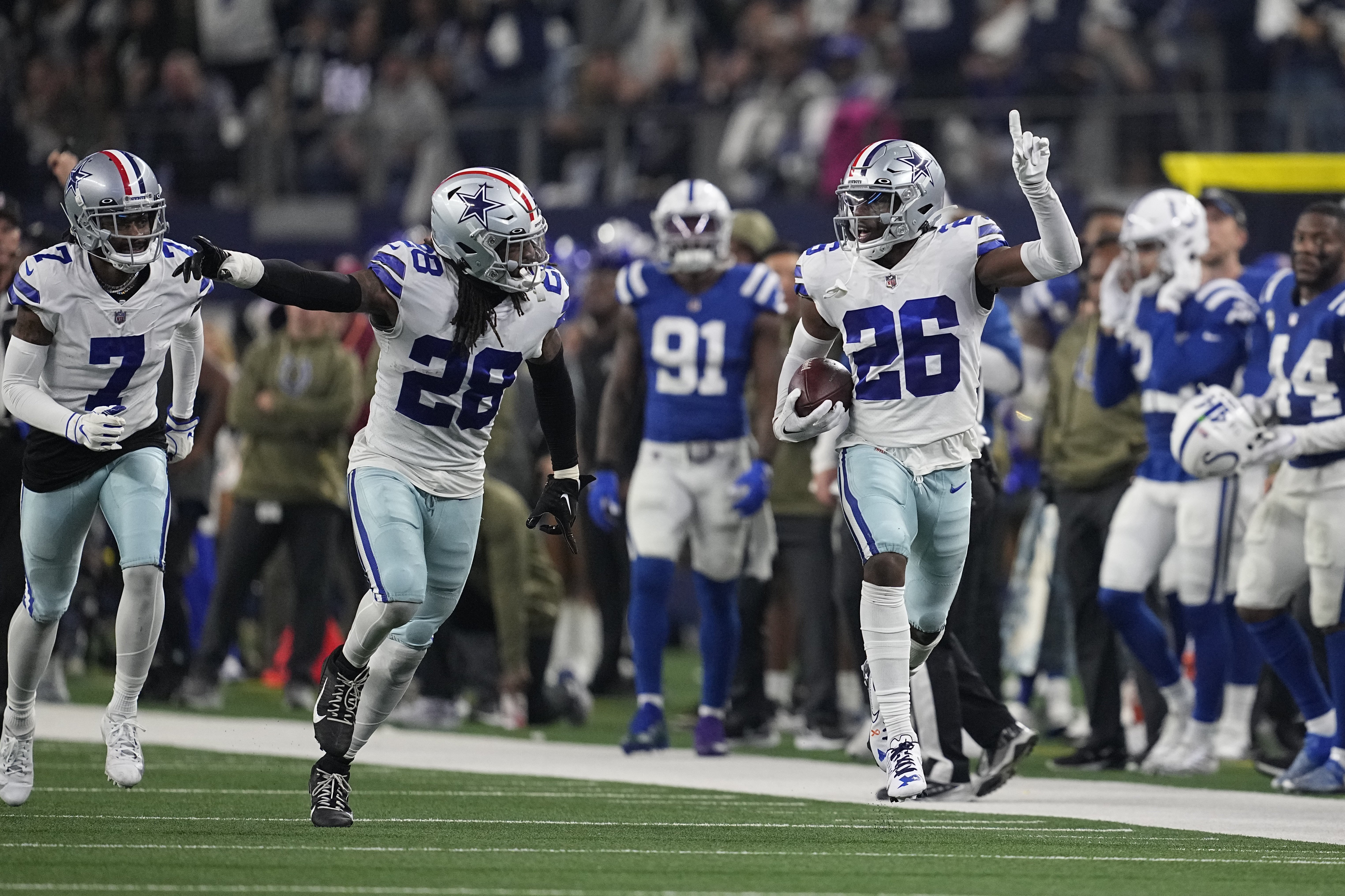 Dallas Cowboys' DaRon Bland (26) reacts after an interception during the second half of an NFL football game against the Indianapolis Colts, Sunday, Dec. 4, 2022, in Arlington, Texas. 