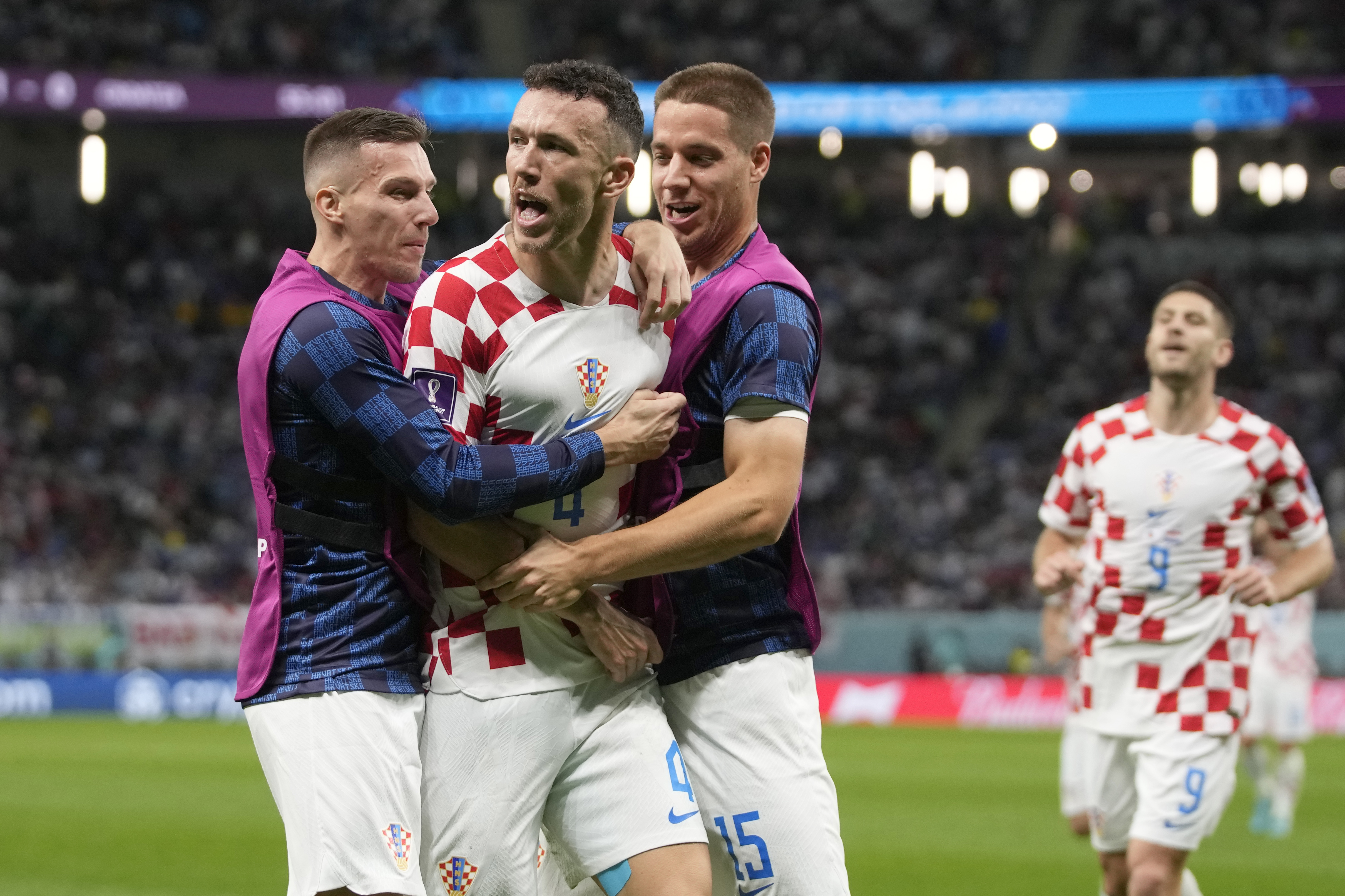 Croatia's Ivan Perisic, second left, celebrates with teammates after scoring his side's opening goal during the World Cup round of 16 soccer match between Japan and Croatia at the Al Janoub Stadium in Al Wakrah, Qatar, Monday, Dec. 5, 2022.