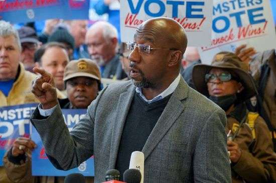 Reverend Raphael Warnock, Democratic senator for Georgia, speaks during a "Get Out the Vote" midterm runoff election rally and Teamsters worksite visit at a UPS facility in Atlanta on Monday.