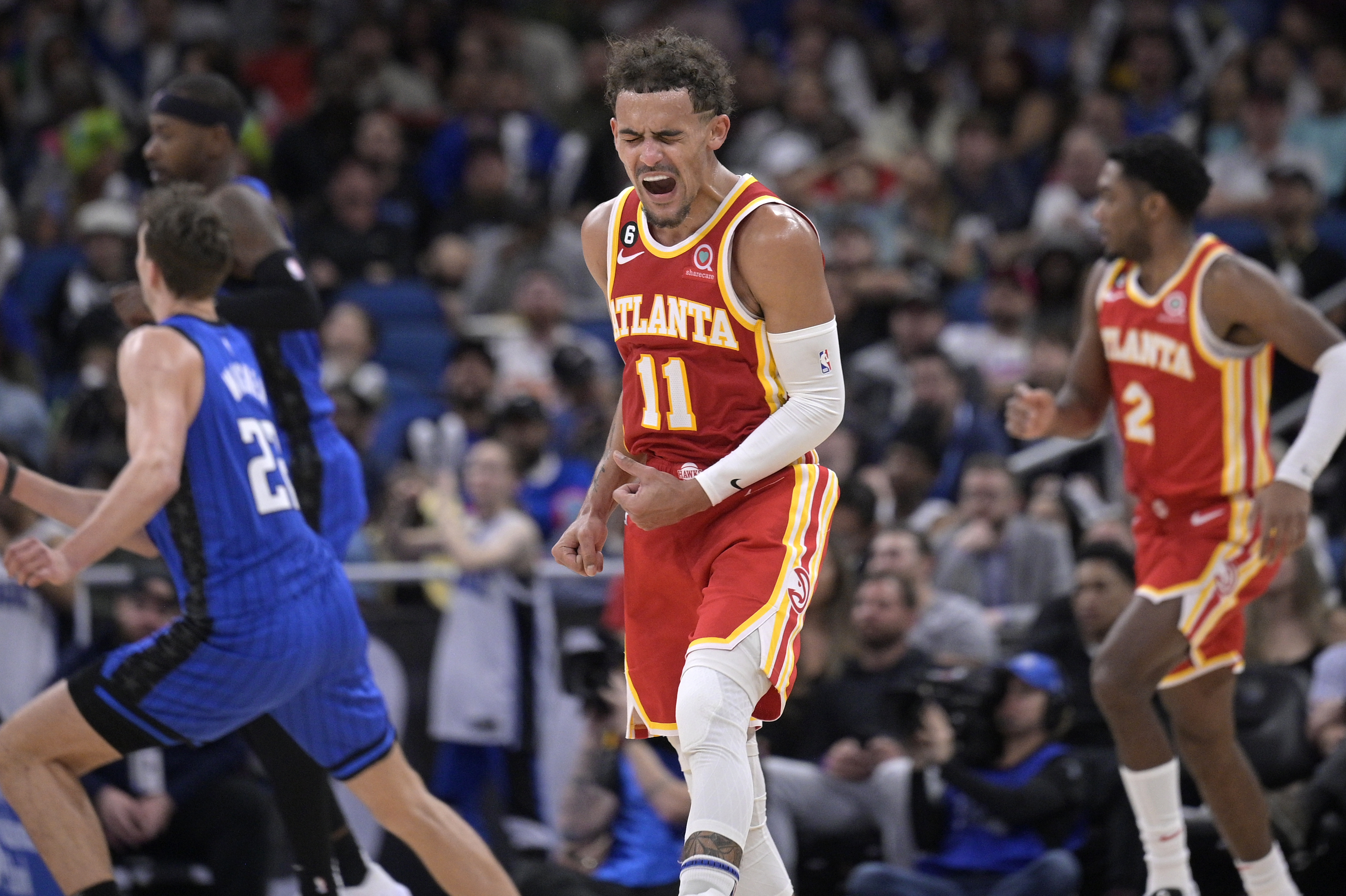 Atlanta Hawks guard Trae Young (11) reacts after a score during the second half of the team's NBA basketball game against the Orlando Magic, Wednesday, Nov. 30, 2022, in Orlando, Fla. 