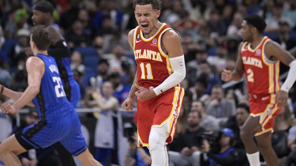 Atlanta Hawks guard Trae Young (11) reacts after a score during the second half of the team's NBA basketball game against the Orlando Magic, Wednesday, Nov. 30, 2022, in Orlando, Fla.