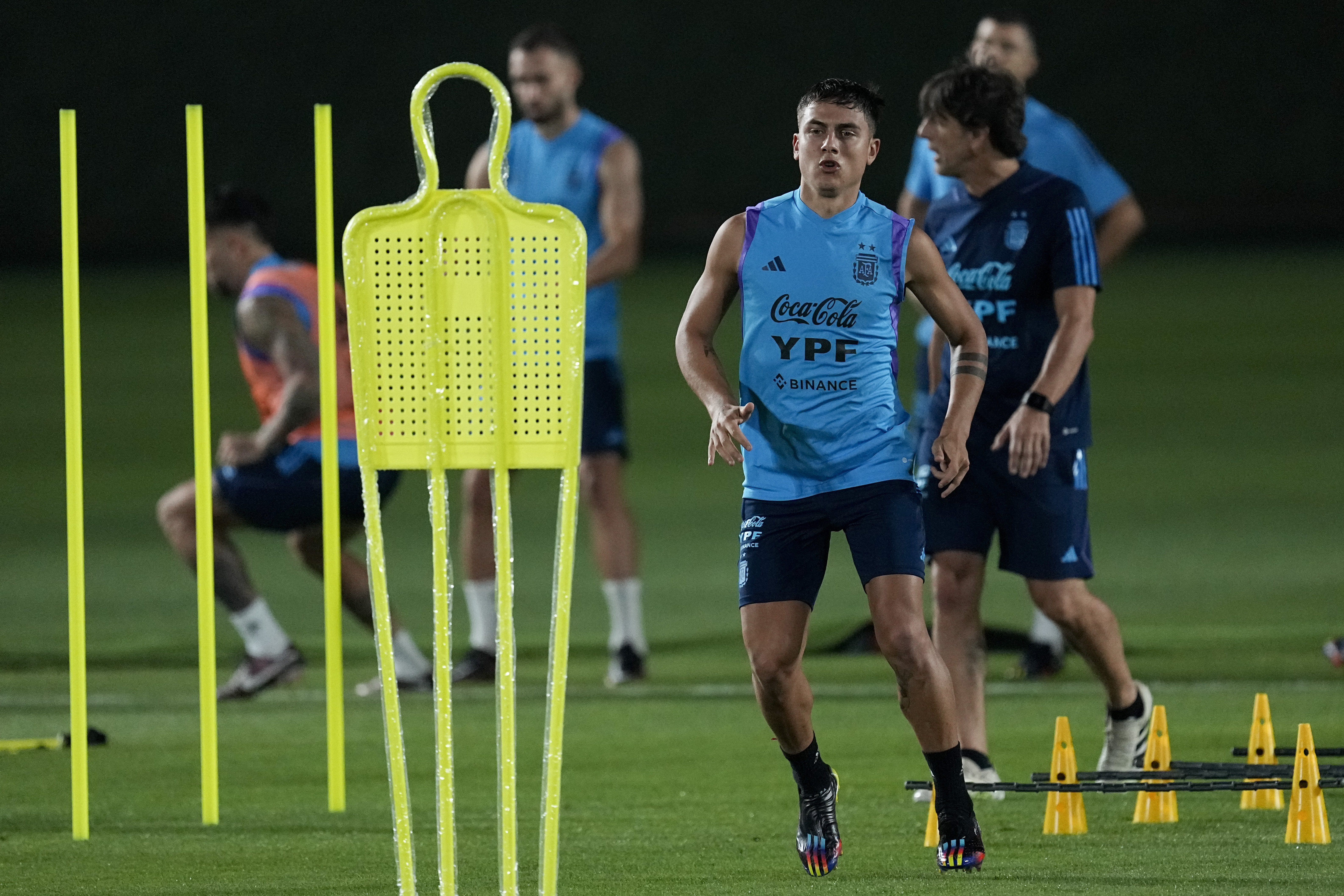 Paulo Dybala runs during a training session of Argentina's national soccer team in Doha, Saturday, Nov. 19, 2022. 