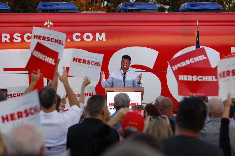 Herschel Walker, the Republican candidate for U.S. Senate in Georgia, speaks during a campaign stop in Smyrna, Ga., Nov. 3, 2022. Walker is in a runoff election with incumbent Democratic Sen. Raphael Warnock.