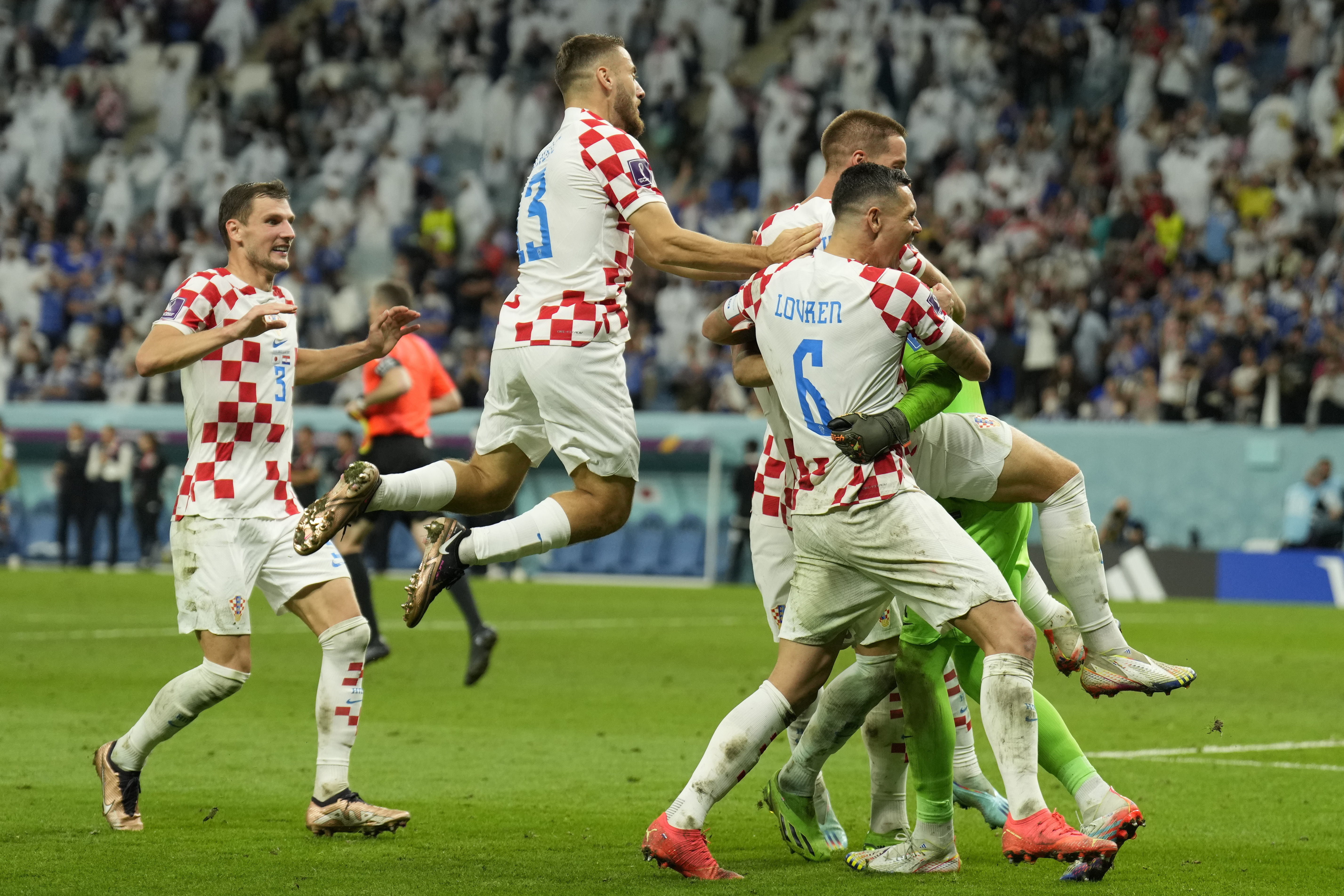 Croatian players celebrate after deafeating Japan during the World Cup round of 16 soccer match between Japan and Croatia at the Al Janoub Stadium in Al Wakrah, Qatar, Monday, Dec. 5, 2022. 