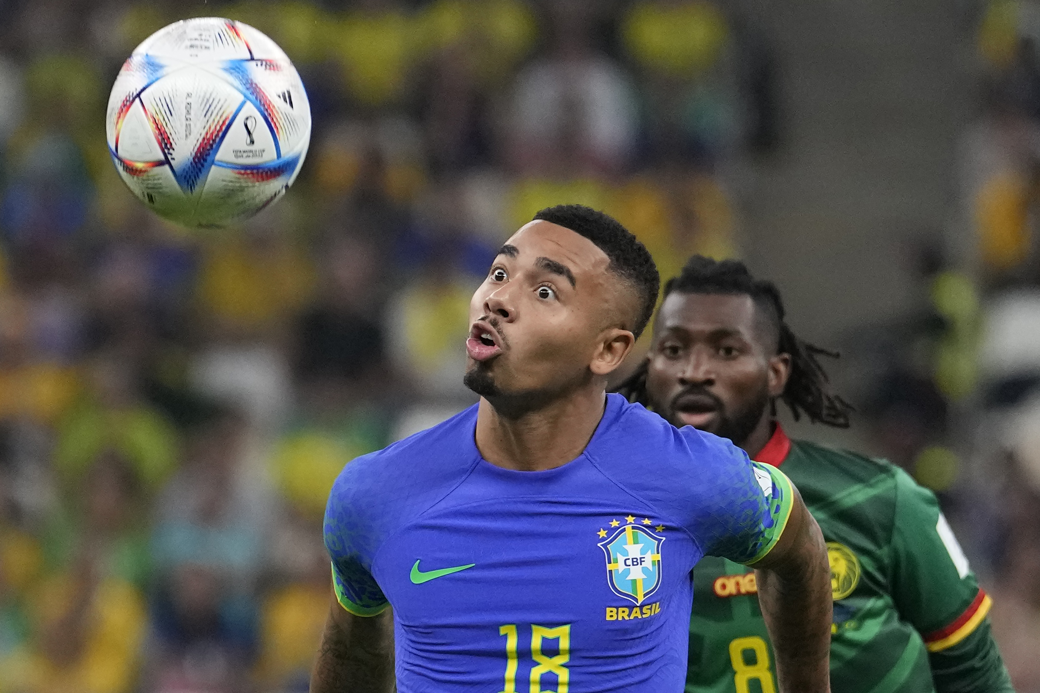 Brazil's Gabriel Jesus, front, and Cameroon's Andre-Frank Zambo Anguissa fight for he ball during the World Cup group G soccer match between Cameroon and Brazil, at the Lusail Stadium in Lusail, Qatar, Friday, Dec. 2, 2022. 