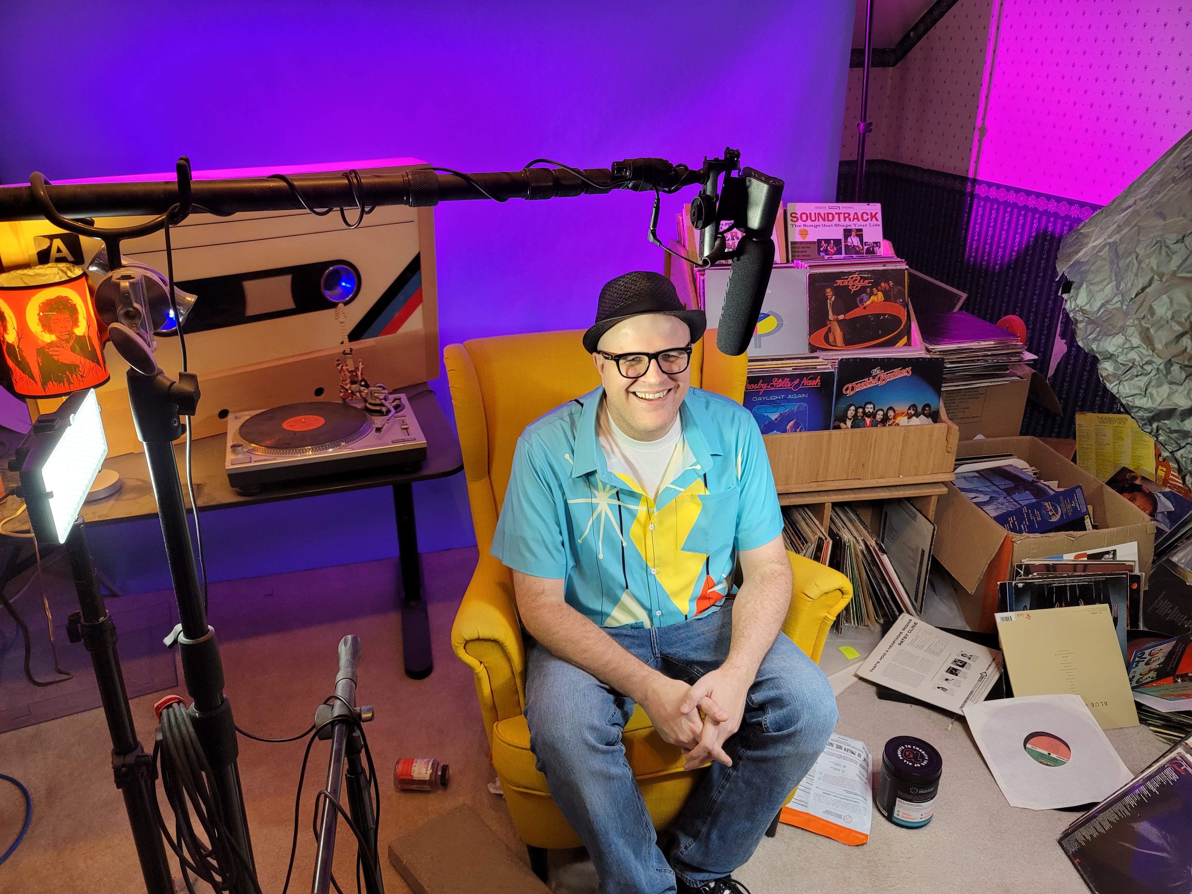 The Professor of Rock, Adam Reader, sitting in his Utah studio.