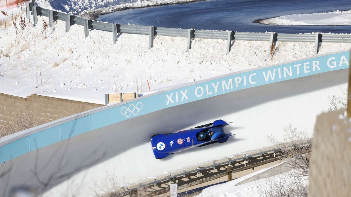 Brad Hall, front, and Taylor Lawrence, of Britain, compete in the men’s two-man bobsled World Cup race Friday, in Park City, Utah. There won't be a final decision next year on which city should host the 2030 Winter Games after all, the International Olympic Committee announced Tuesday, citing concerns about the impact of climate change on potential future hosts.