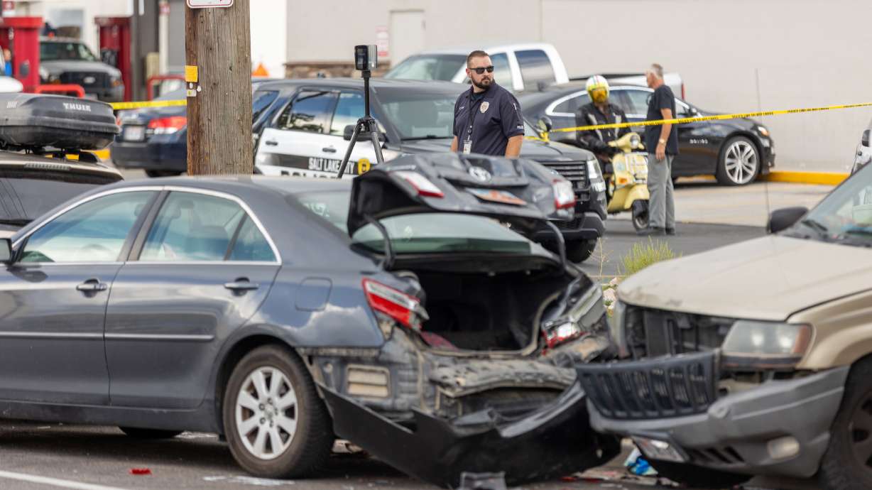 An officer investigates a car crash that involved five vehicles on 400 West in Salt Lake City on Aug. 12. A LendingTree report released on Monday called out Utah drivers, while an Advocates for Highway & Auto Safety report finds Utah has some good traffic laws and also room for improvement.