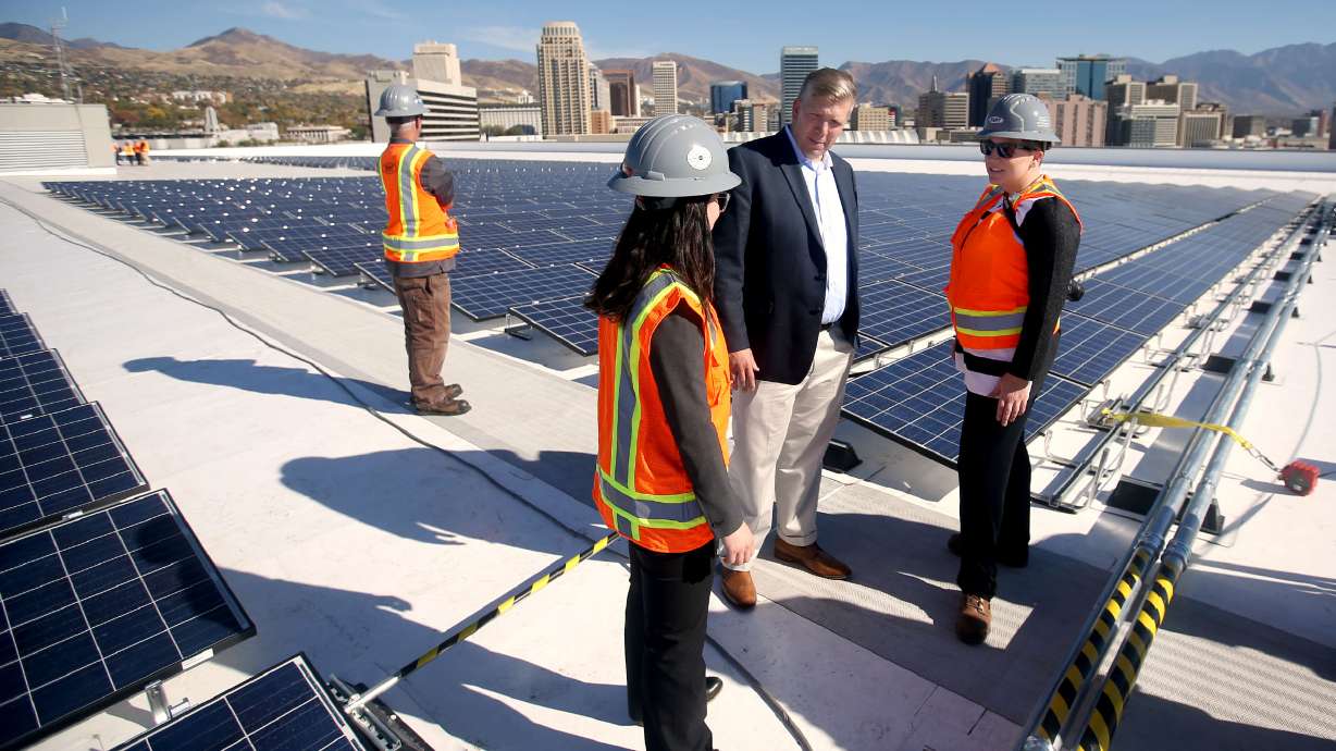Vivint Solar CEO David Bywater, Shawna Cuan of the Governor's Office of Energy Development, and Deb Henry of Hunt Electric discuss the new rooftop solar installation at Vivint Smart Home Arena in Salt Lake City on Oct. 26, 2016. Provo-based Vivint Smart Home is being acquired by NRG Energy in a $2.8 billion deal that is expected to close at the end of the first quarter of 2023.