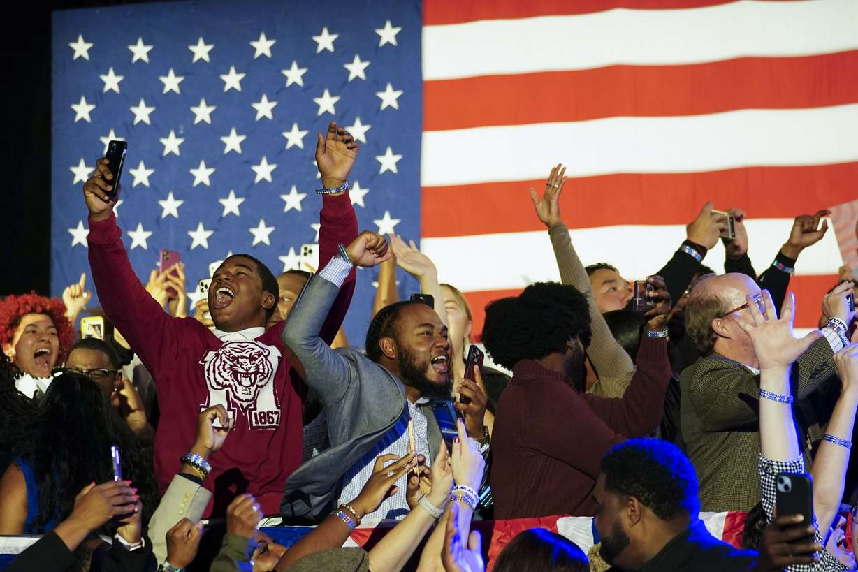 Supporters cheer during an election night watch party for Democratic Sen. Raphael Warnock, Tuesday, in Atlanta. Warnock has defeated Republican challenger Herschel Walker in a runoff election in Georgia.