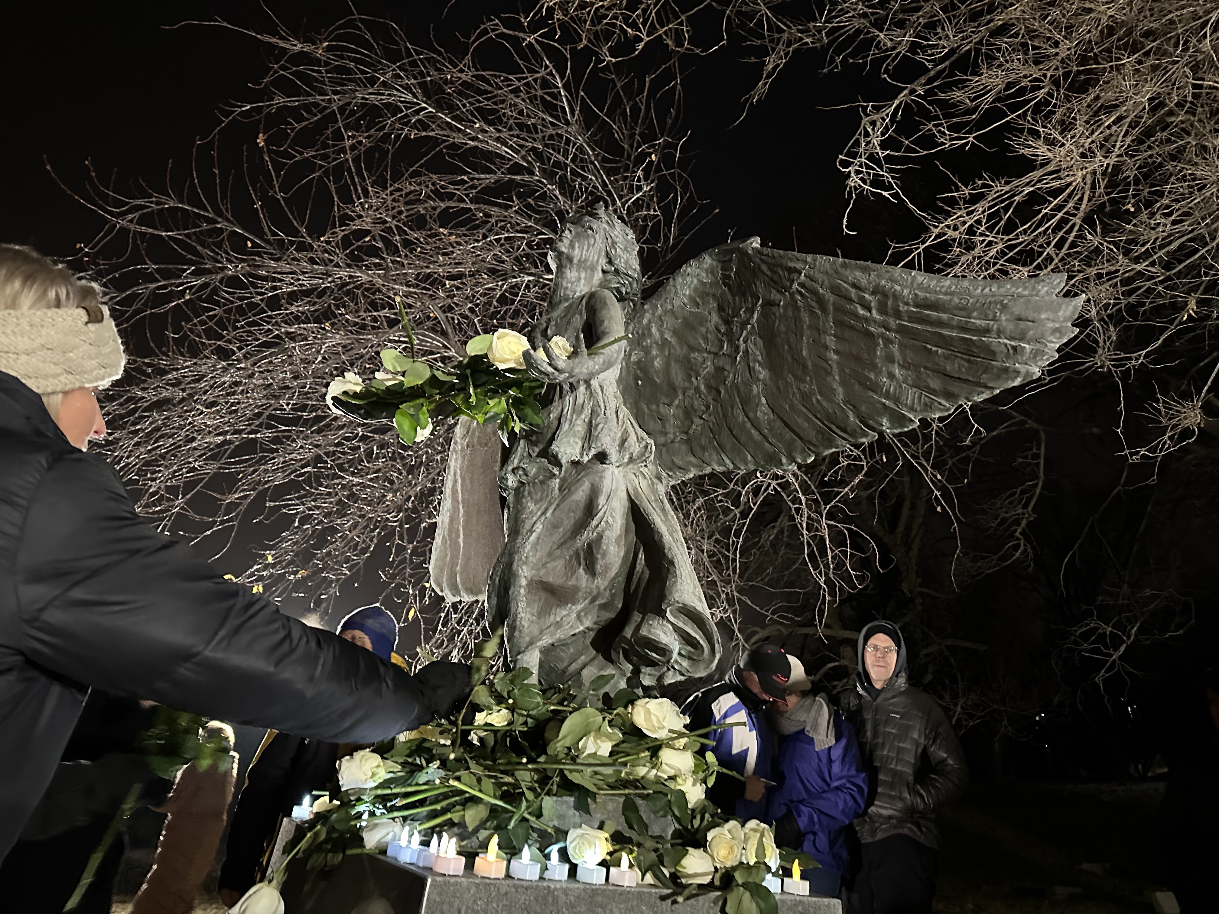 More than 90 people gathered Tuesday evening to honor children who have died in a Christmas Box Angel vigil. At the end of the event, participants placed flowers and candles on the angel statue in the Salt Lake City Cemetery. 