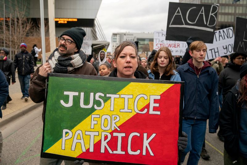 Demonstrators protest the killing of Patrick Lyoya, an unarmed Black man who was shot and killed by a Grand Rapids Police officer during a traffic stop on April 4, in Grand Rapids, Michigan, April 16.