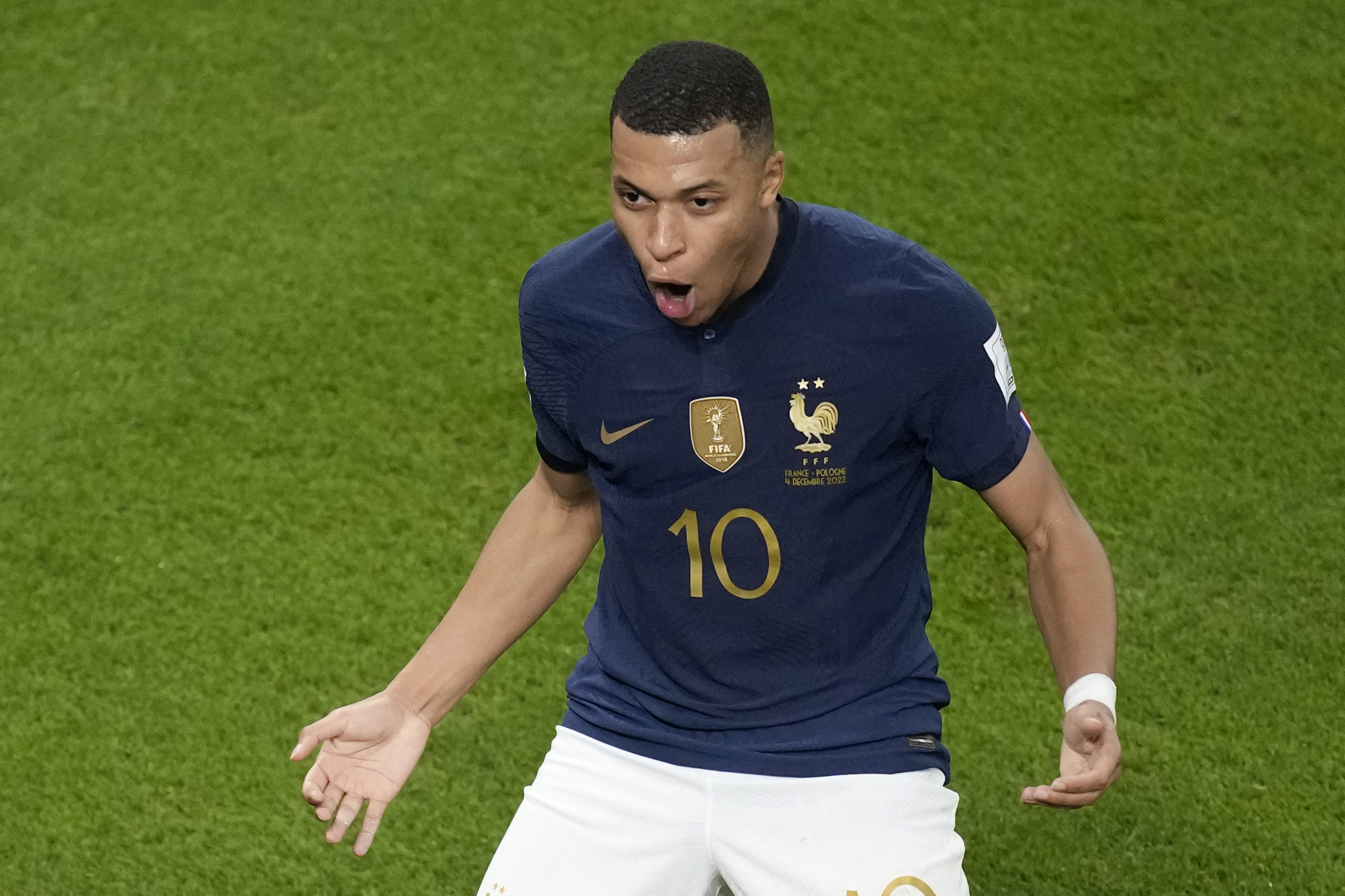 France's Kylian Mbappe celebrates after scoring his side's second goal during the World Cup round of 16 soccer match between France and Poland, at the Al Thumama Stadium in Doha, Qatar, Sunday, Dec. 4, 2022. 