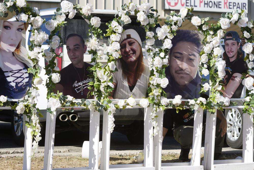 Photographs of victims of a mass shooting at a nearby gay nightclub are on display at a memorial on Nov. 22 in Colorado Springs, Colo. The suspect accused of entering the club clad in body armor and opening fire with an AR-15-style rifle, killing five people and wounding 17 others.