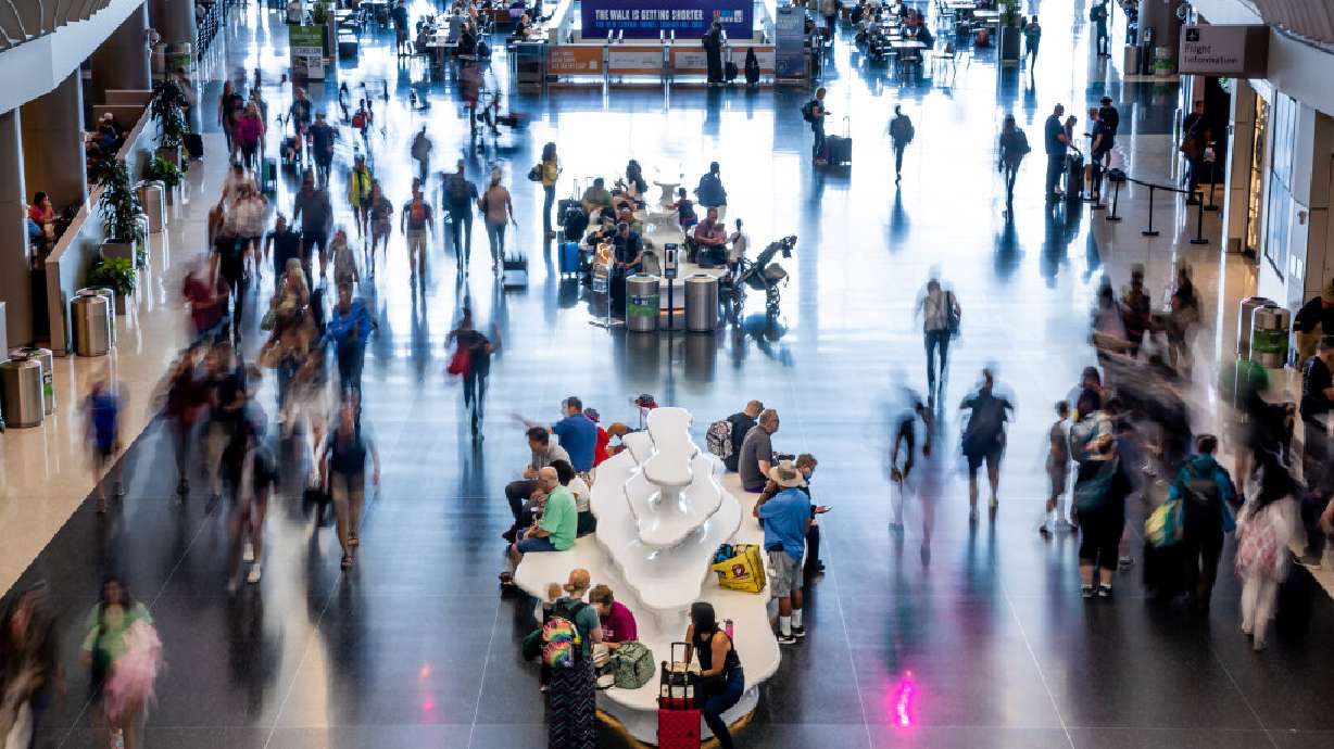 Travelers move through the Salt Lake City International Airport in Salt Lake City on July 1.