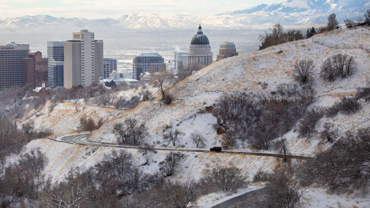 A car travels through Bonneville Boulevard by the mouth of City Creek Canyon in Salt Lake City after a snowstorm on Dec. 2. A small storm may create more traffic headaches Wednesday evening into early Thursday.