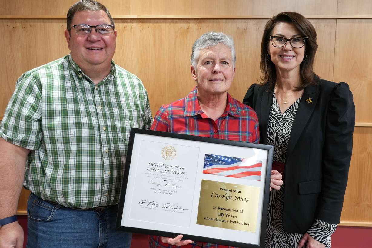 Carolyn Jones, center, poses for a photo with Iron County Clerk Jon Whittaker and Lt. Gov. Deidre Henderson. Jones was honored last week for 50 years of service as a poll worker in Iron County.