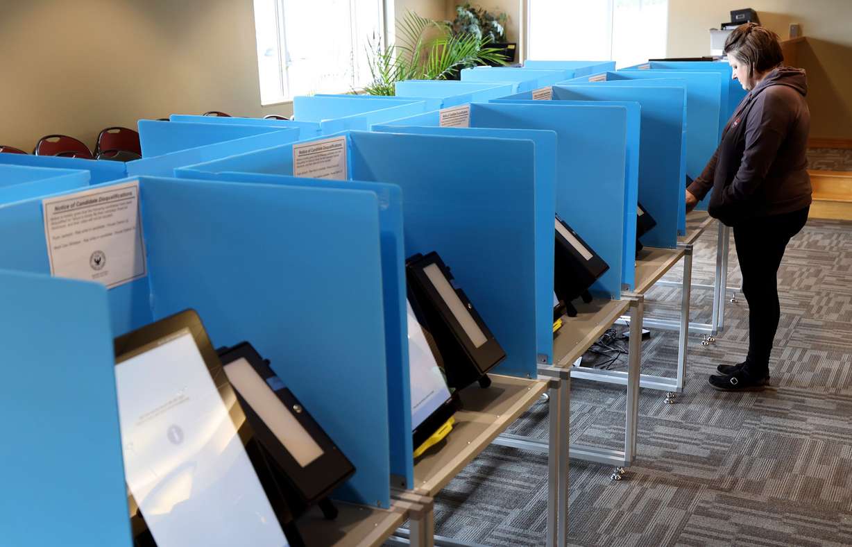 Mary Cavanaugh votes at Taylorsville City Hall on Election Day in Taylorsville on Nov. 8.