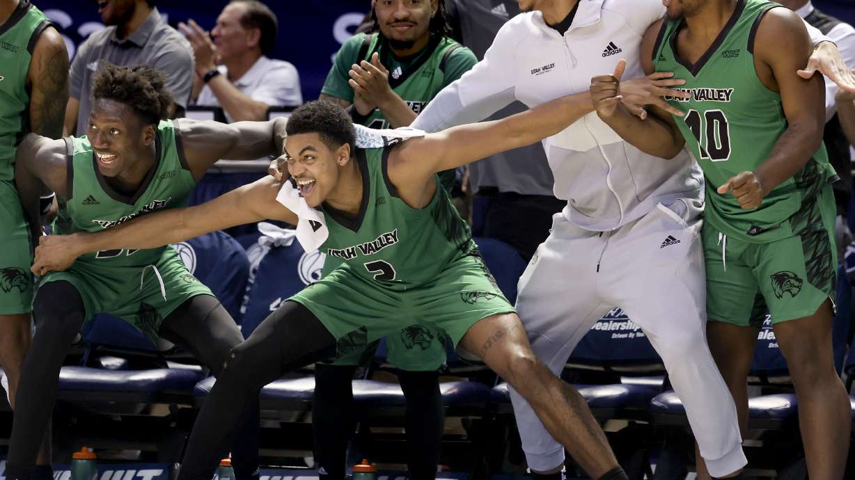 The UVU bench celebrates during the game at BYU in Provo on Wednesday, Dec. 7, 2022.
