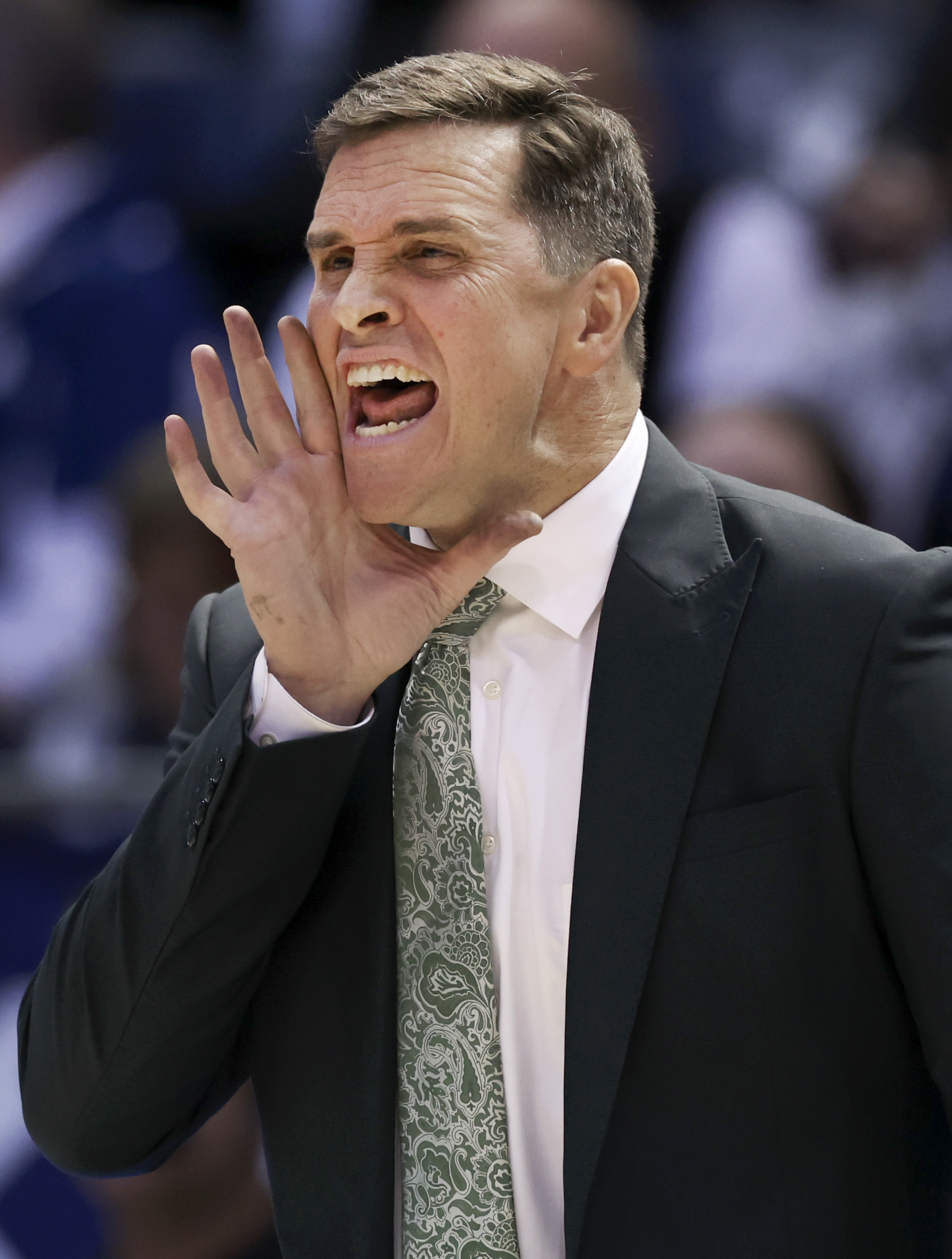 UVU Basketball Coach Mark Madsen screams plays during the game against BYU at BYU in Provo on Wednesday, Dec. 7, 2022.