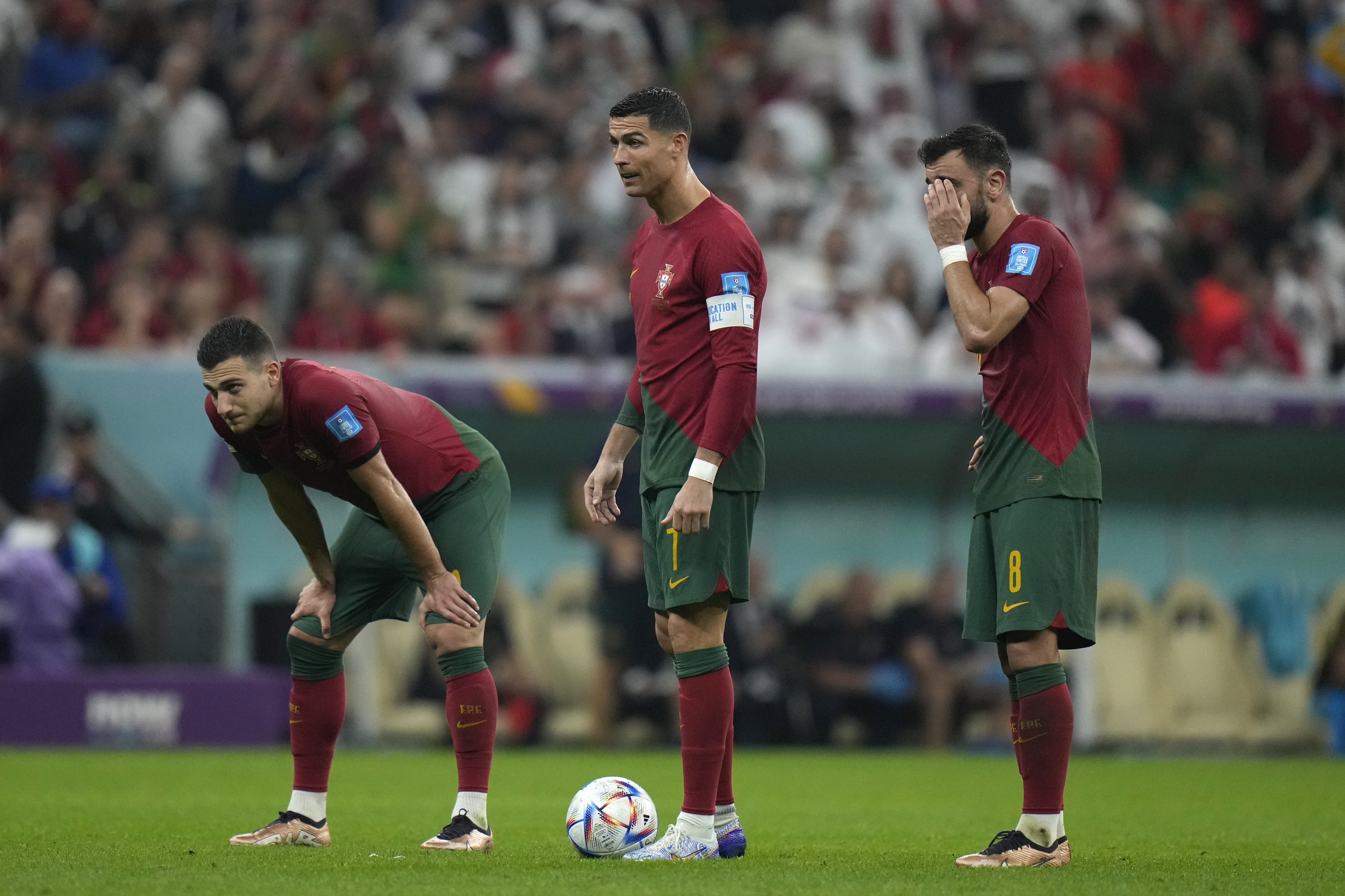 Portugal's Cristiano Ronaldo, center, stands with his teammates during the World Cup round of 16 soccer match between Portugal and Switzerland, at the Lusail Stadium in Lusail, Qatar, Tuesday, Dec. 6, 2022. 