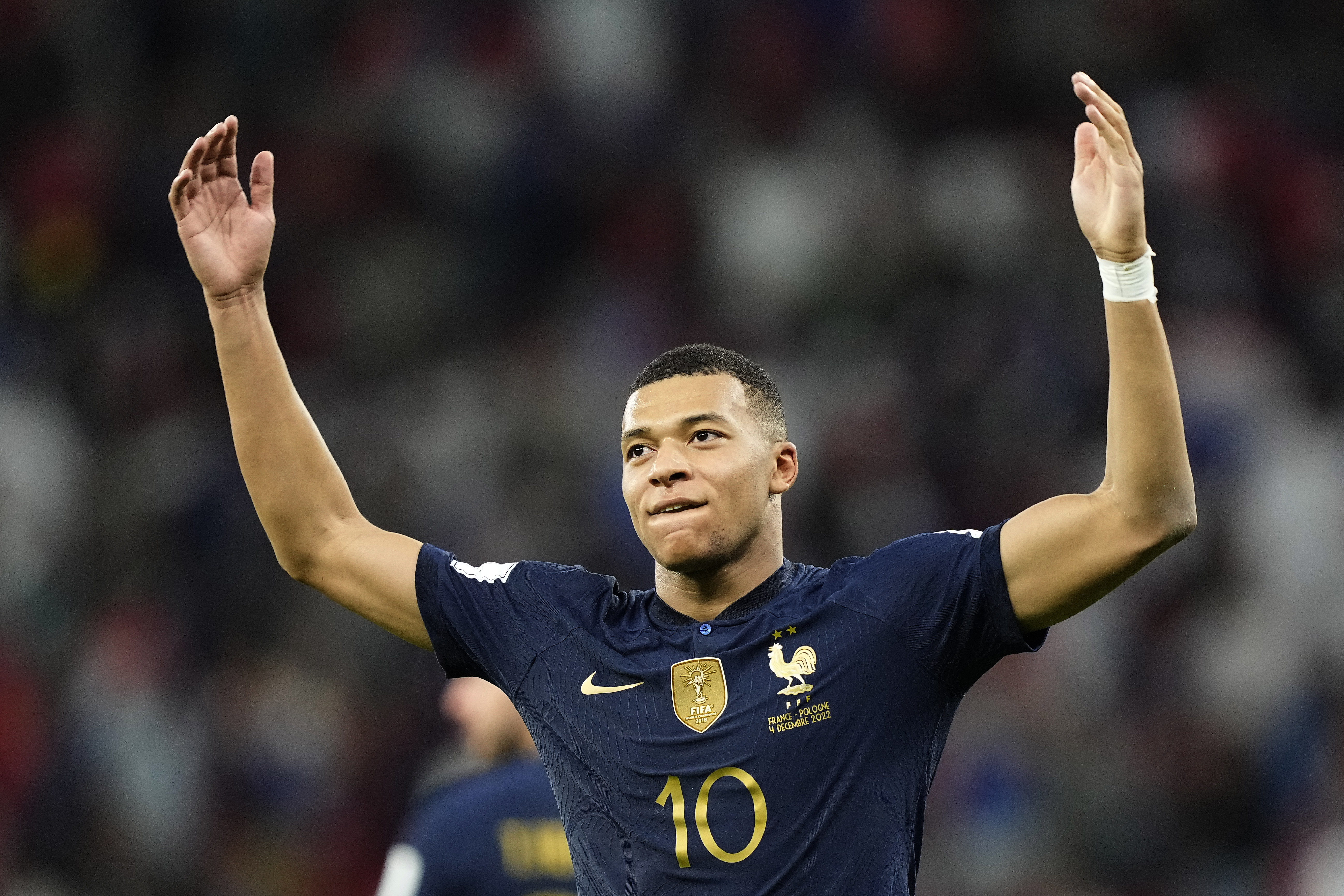 France's Kylian Mbappe celebrates scoring his side's third goal during the World Cup round of 16 soccer match between France and Poland, at the Al Thumama Stadium in Doha, Qatar, Sunday, Dec. 4, 2022. 