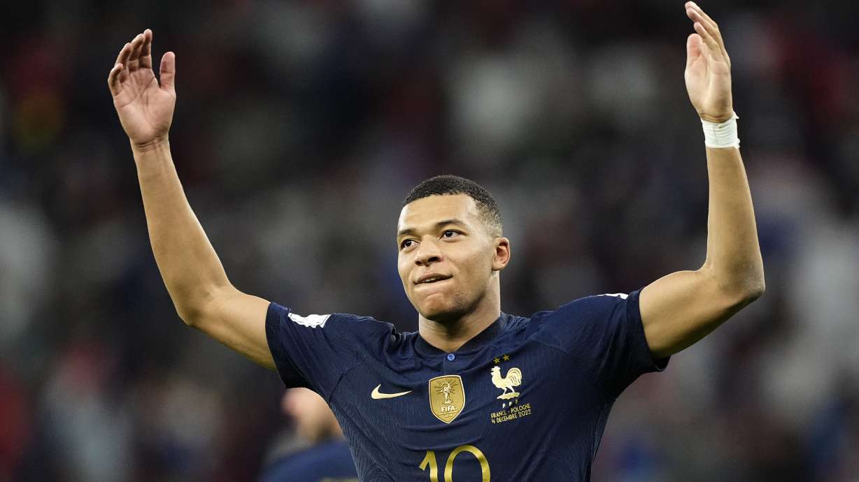 France's Kylian Mbappe celebrates scoring his side's third goal during the World Cup round of 16 soccer match between France and Poland, at the Al Thumama Stadium in Doha, Qatar, Sunday, Dec. 4, 2022.