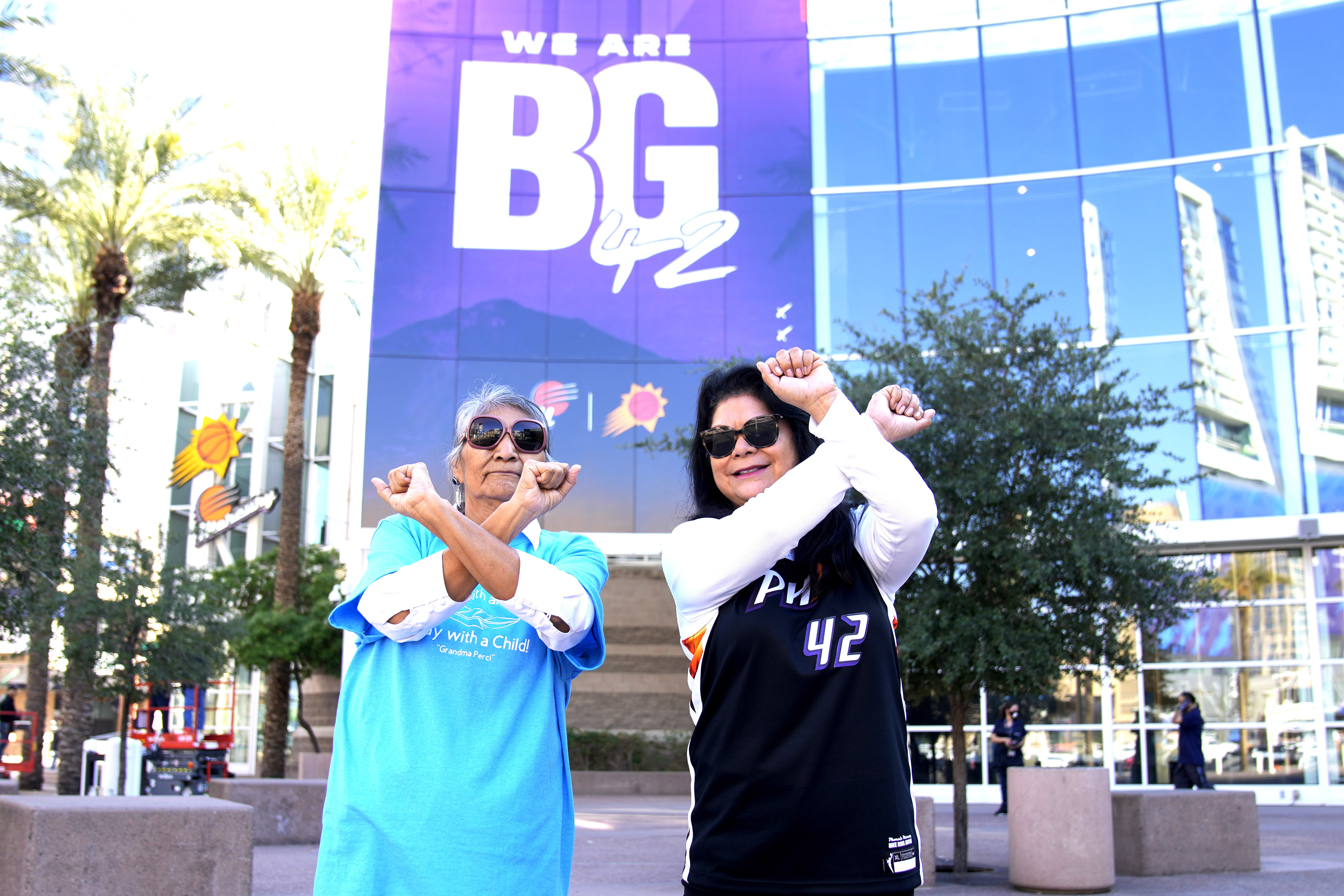 Perci Ami, left, of Laveen, Ariz., and Patty Talahongva show support for Brittney Griner, Thursday, Dec. 8, 2022, in Phoenix. Griner was released from a Russian prison in a prisoner swap earlier in the day. 