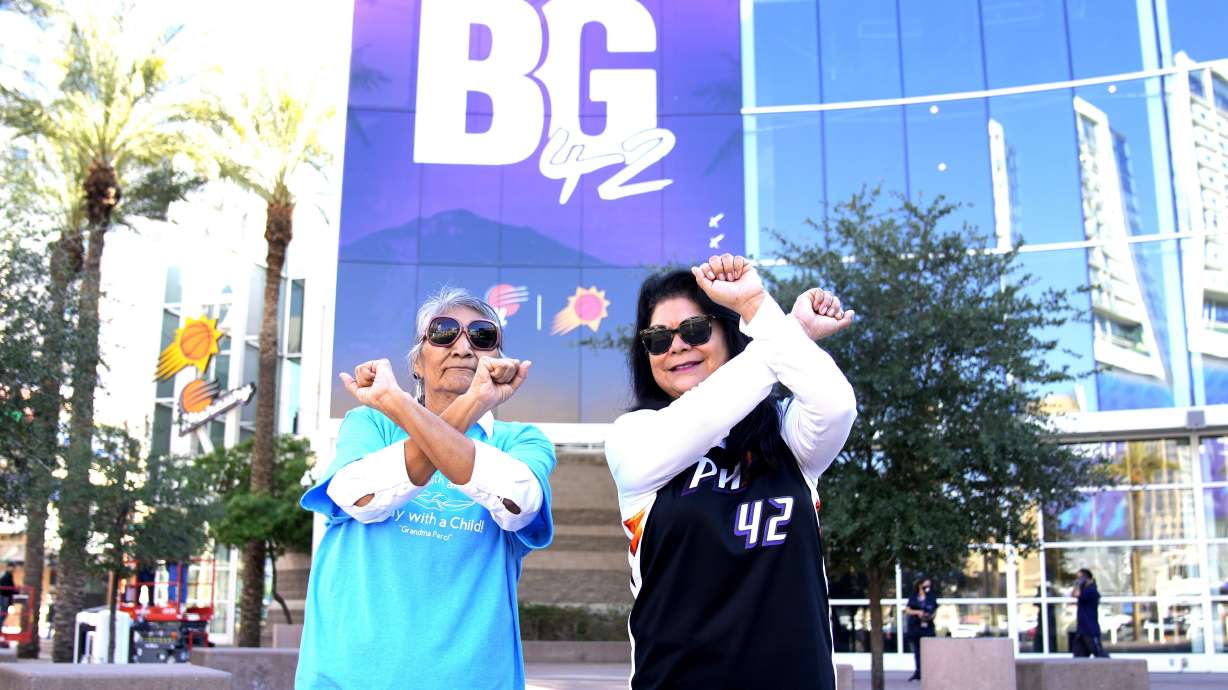 Perci Ami, left, of Laveen, Ariz., and Patty Talahongva show support for Brittney Griner, Thursday, Dec. 8, 2022, in Phoenix. Griner was released from a Russian prison in a prisoner swap earlier in the day.