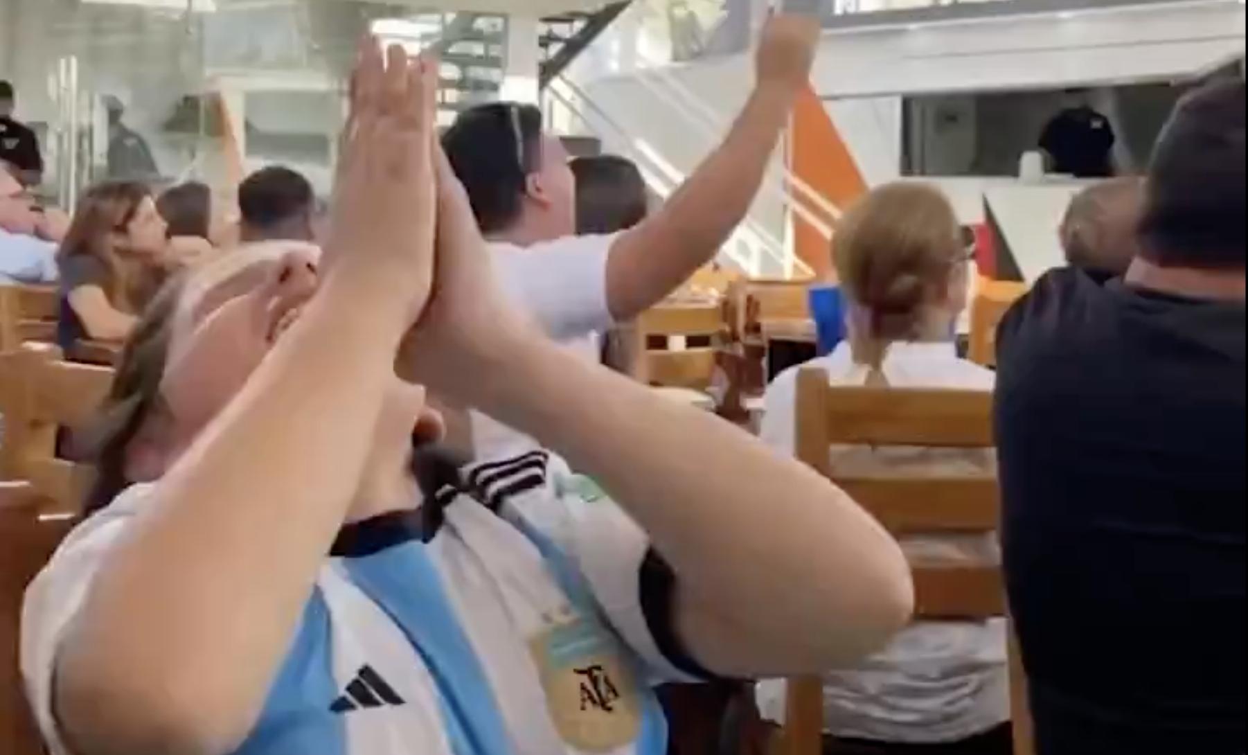 A young blind boy celebrates Messi's goal against Mexico in the World Cup on Nov. 26.
