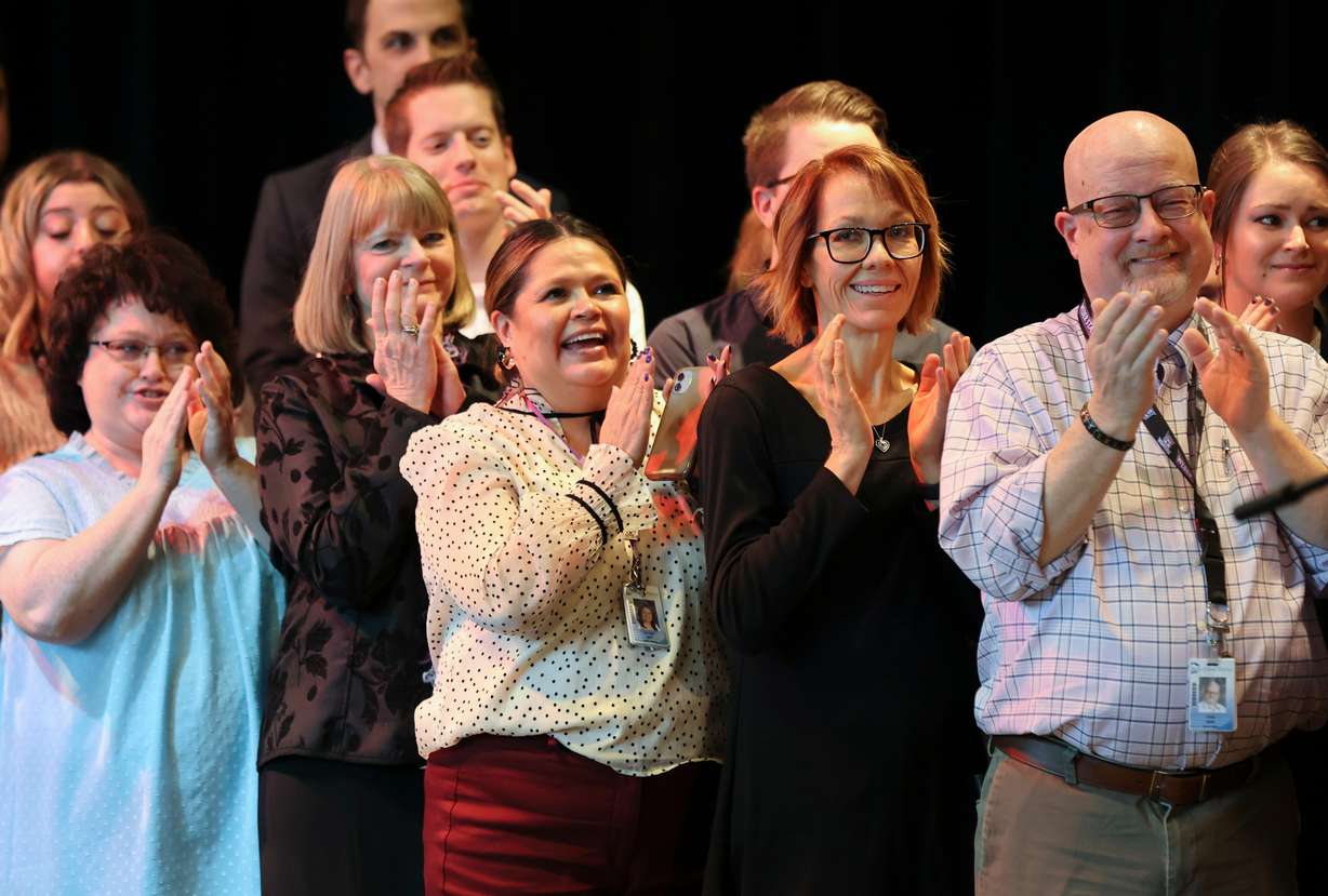 Teachers, education administrators and community council members react as Gov. Spencer Cox announces that his fiscal year 2024 budget recommendations will include salary raises for educators at Centennial Junior High School in Kaysville on Thursday.