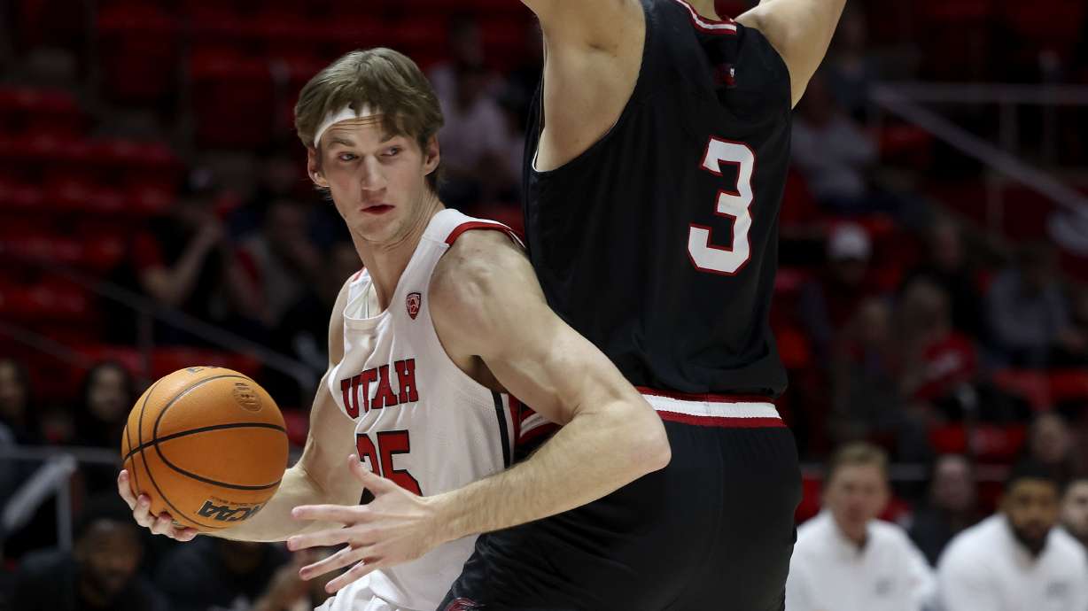 Utah Utes center Branden Carlson (35) drives around Jacksonville State Gamecocks center Maros Zeliznak (3) at the Jon M. Huntsman Center in Salt Lake City on Thursday, Dec. 8, 2022.