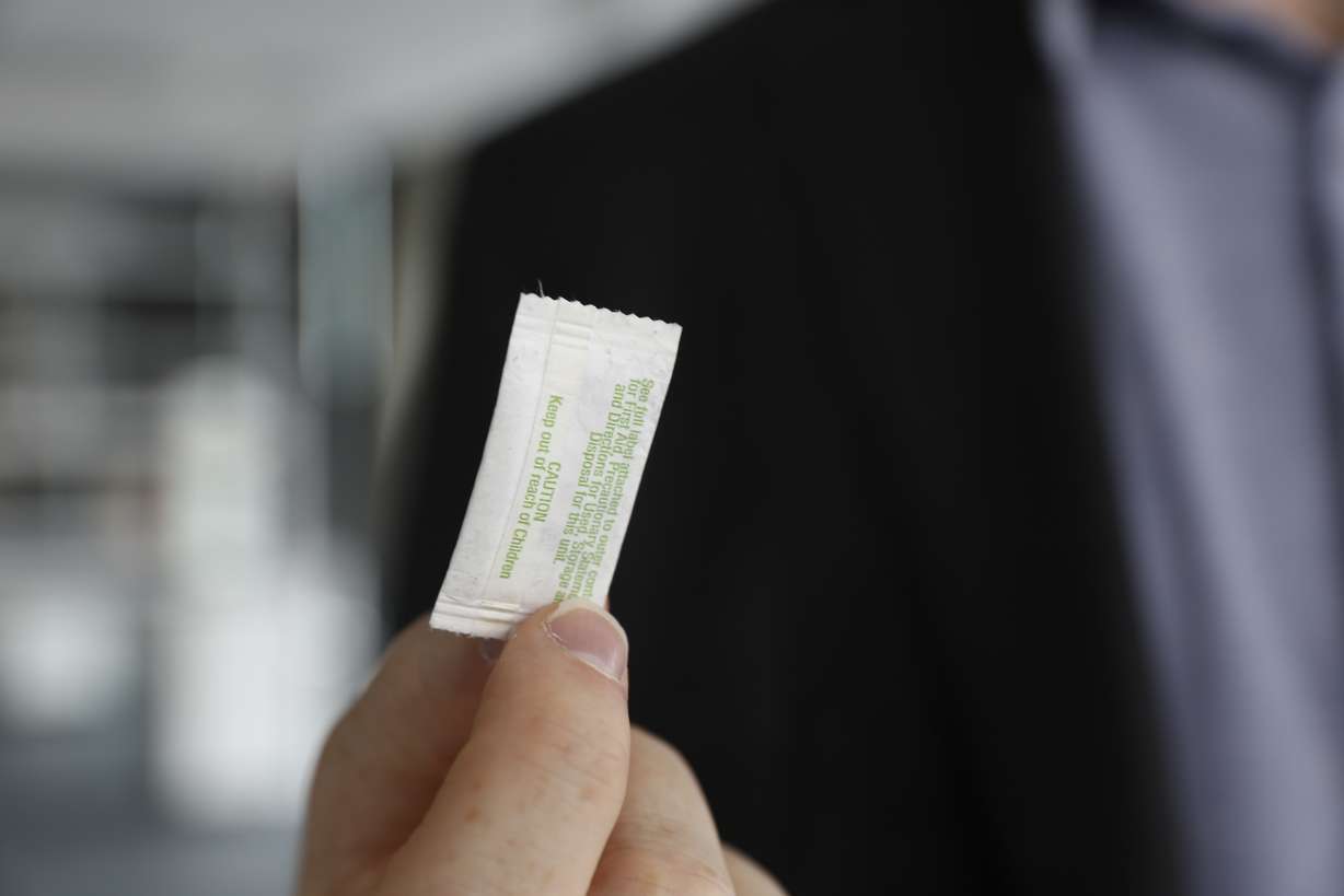 Patrick Flynn, a co-founder of Hazel Technologies, holds a sachet designed to slow the ripening of process of various fruits, Oct. 24 in Chicago. The ingredients of the packet use scientific concepts to inhibit the naturally occurring hormone ethylene, which causes produce to ripen.