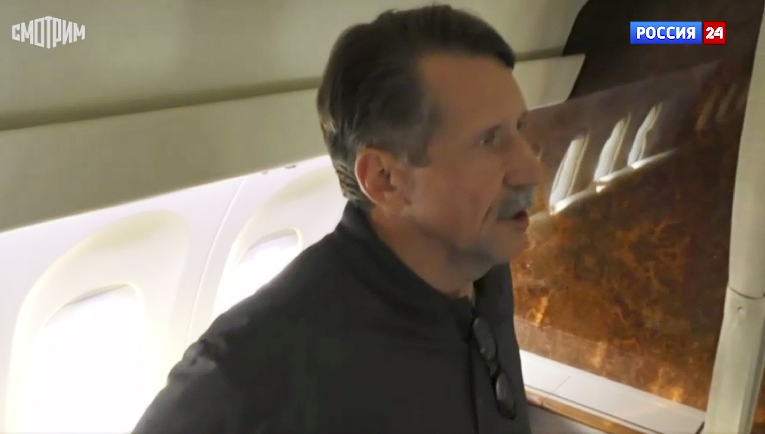 In this image taken from video provided by RU-24 Russian Television on Friday, Russian citizen Viktor Bout who was exchanged for U.S. basketball player Brittney Griner, speaks in a Russian plane after a swap, in the airport of Abu Dhabi, United Arab Emirates.
