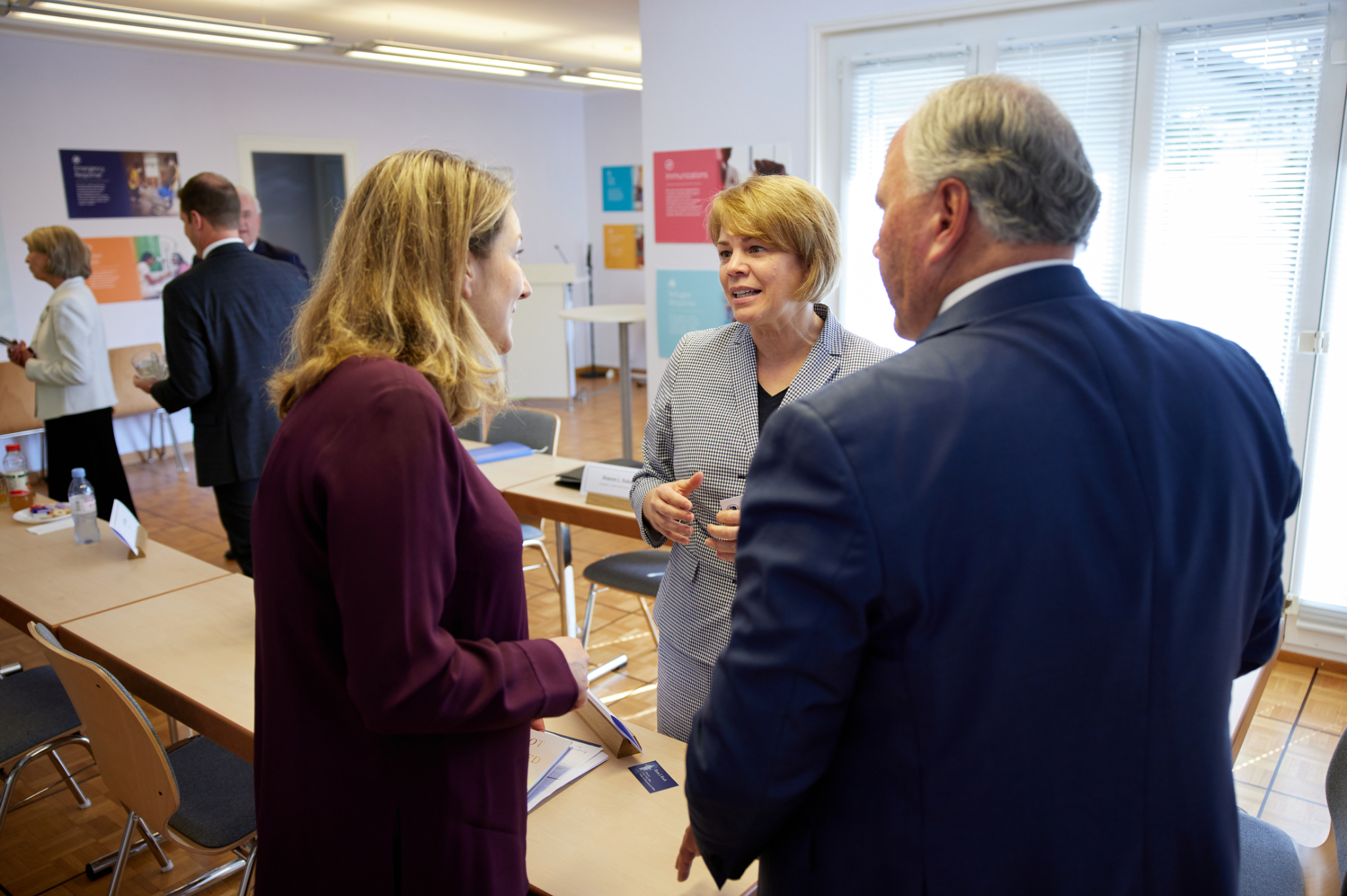 UNICEF's Carla Haddad Mardini, left, speaks with Elder Ronald A. Rasband of the Quorum of the Twelve Apostles of The Church of Jesus Christ of Latter-day Saints, and Sharon Eubank, middle, the church’s director of Humanitarian Services, during a meeting at the G20 Interfaith Forum in Bologna, Italy, in September 2021. The church announced a $10 million donation on Friday, with $5 million directed to UNICEF to address maternal and neonatal tetanus.