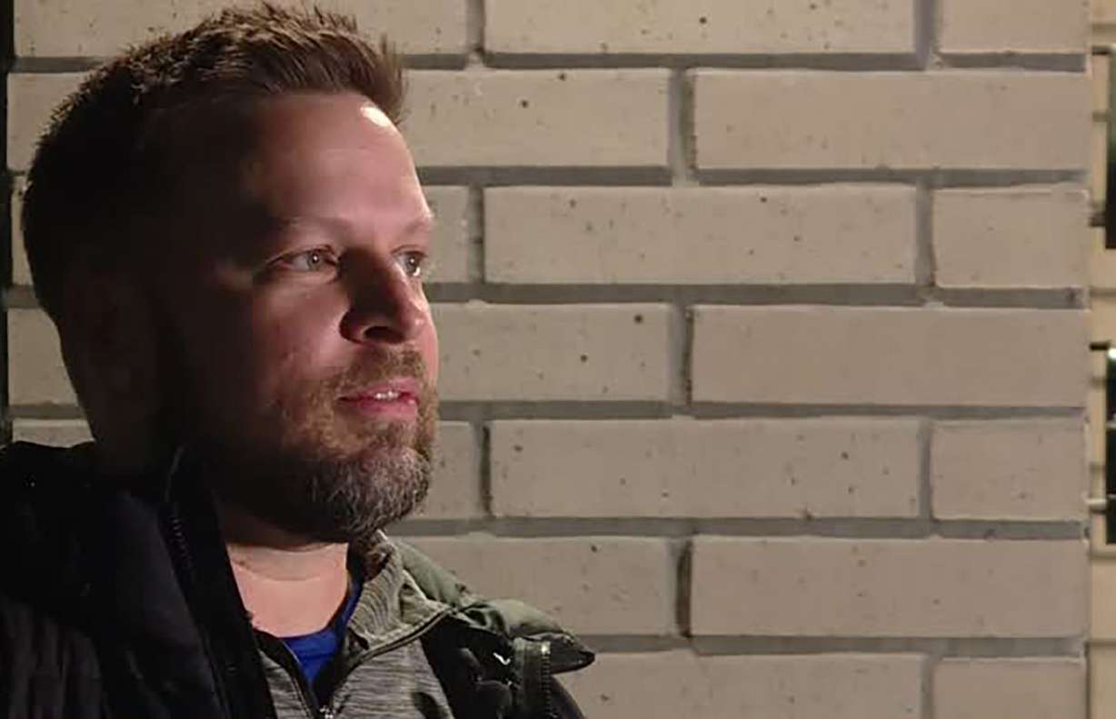 Chris Holland talks to KSL Thursday. He says he saw on doorbell video someone taking a package from his porch in Sandy.