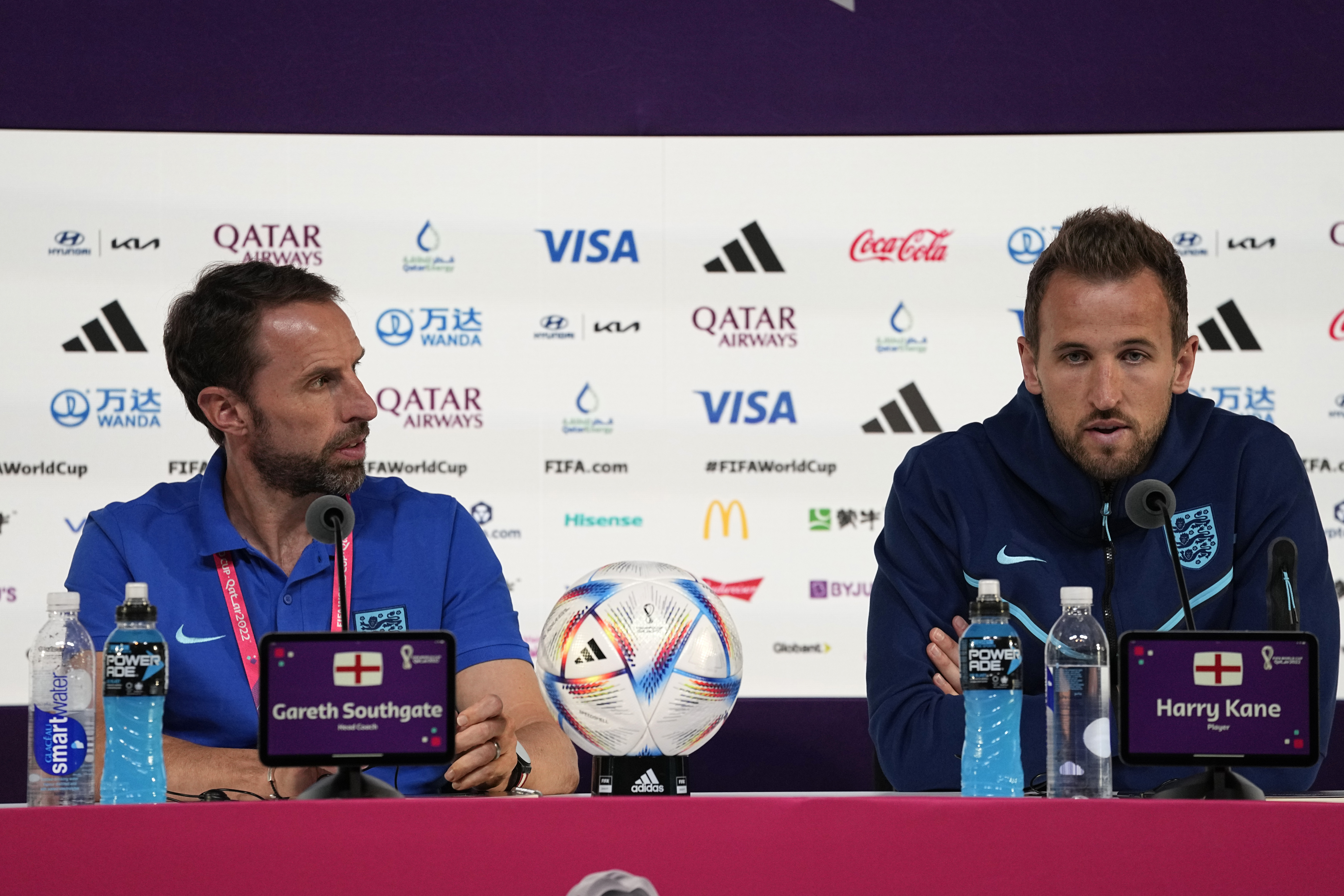 England's head coach Gareth Southgate, left, and Harry Kane speak to the media during a press conference at the Qatar National Convention Center on the eve of the quarterfinal World Cup soccer match between France and England, in Doha, Qatar, Friday, Dec. 9, 2022. 