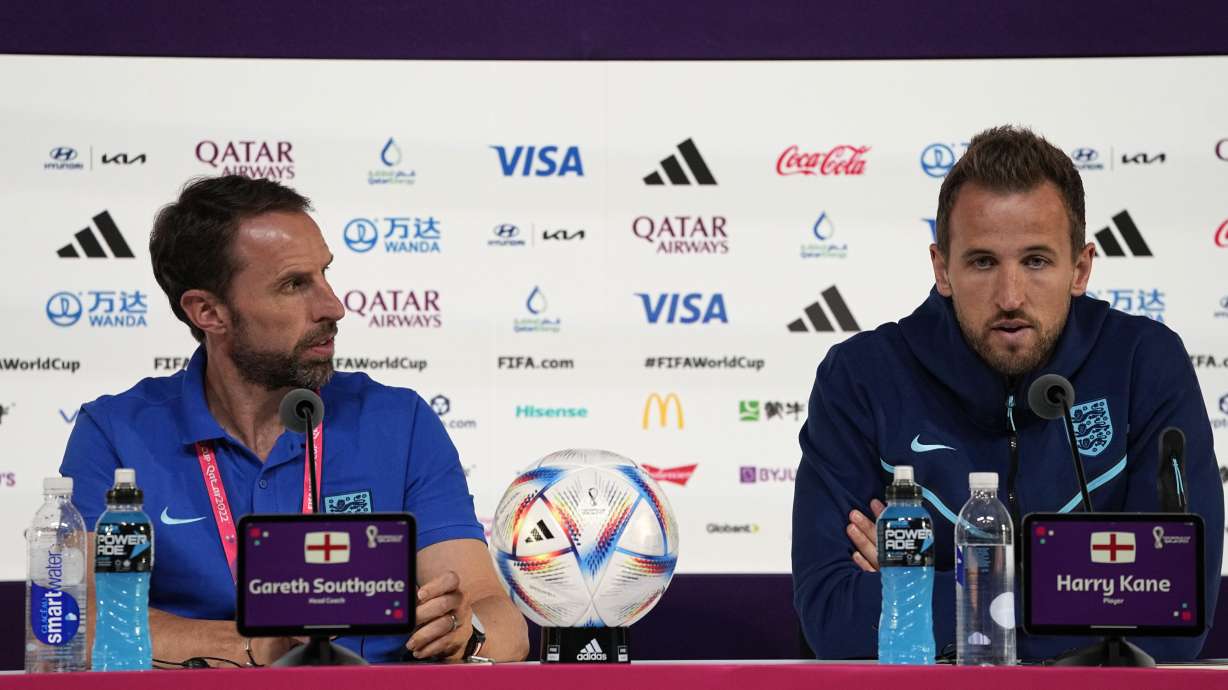 England's head coach Gareth Southgate, left, and Harry Kane speak to the media during a press conference at the Qatar National Convention Center on the eve of the quarterfinal World Cup soccer match between France and England, in Doha, Qatar, Friday, Dec. 9, 2022.