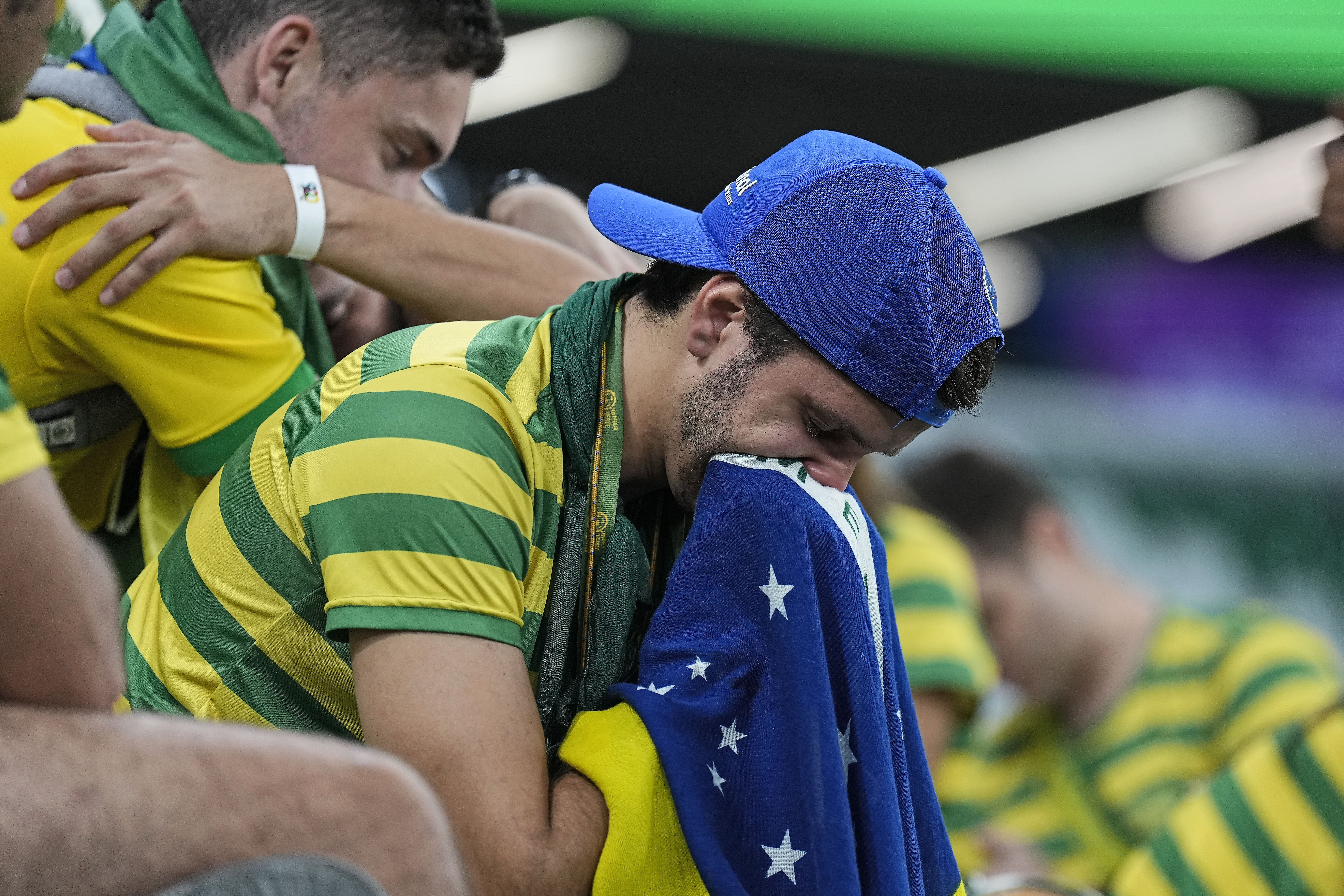 Brazilian fans react on the tribune after losing the World Cup quarterfinal soccer match between Croatia and Brazil, at the Education City Stadium in Al Rayyan, Qatar, Friday, Dec. 9, 2022. 