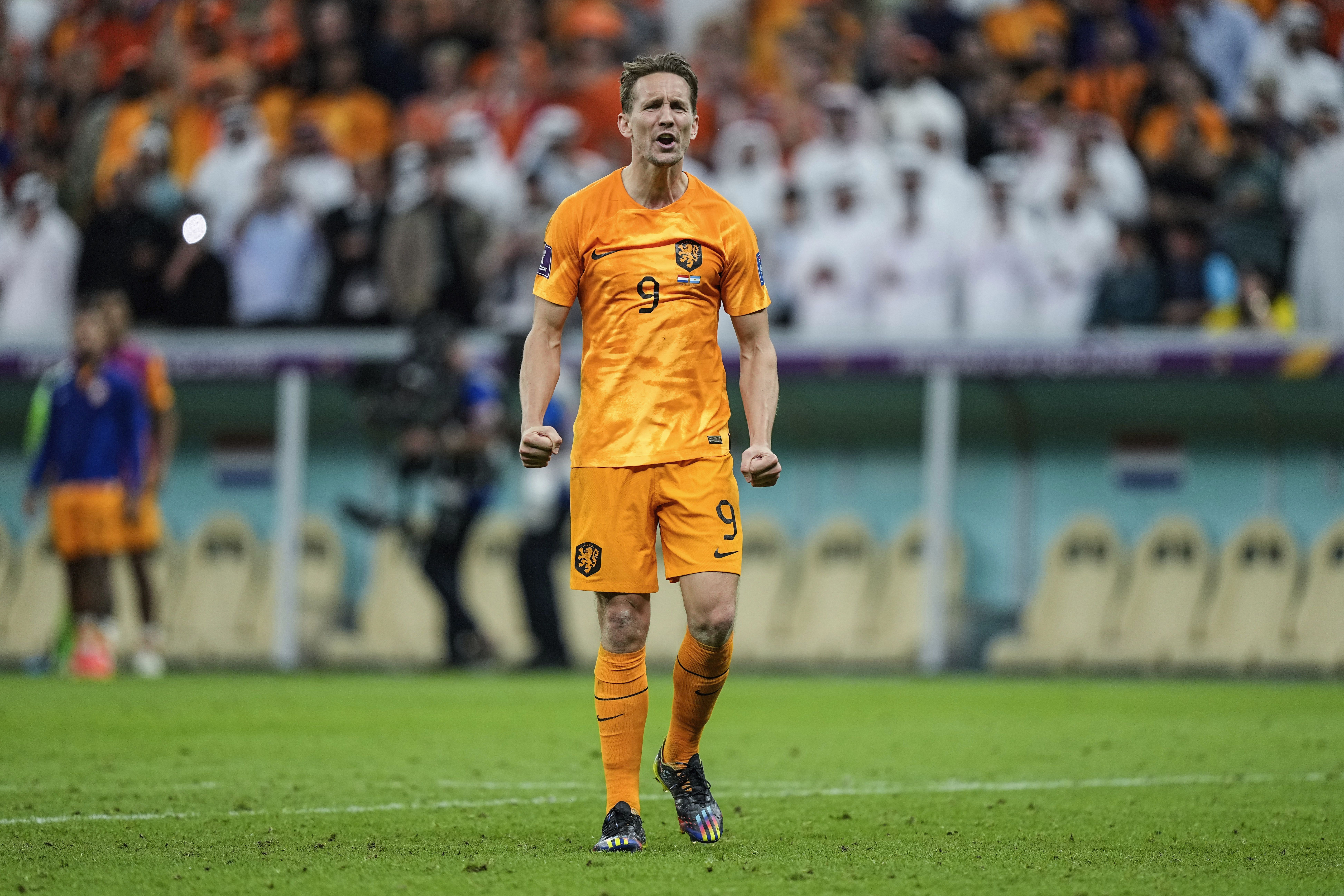 Luuk de Jong of the Netherlands celebrates after scoring a penalty kick during the World Cup quarterfinal soccer match between the Netherlands and Argentina, at the Lusail Stadium in Lusail, Qatar, Saturday Dec. 10, 2022. 