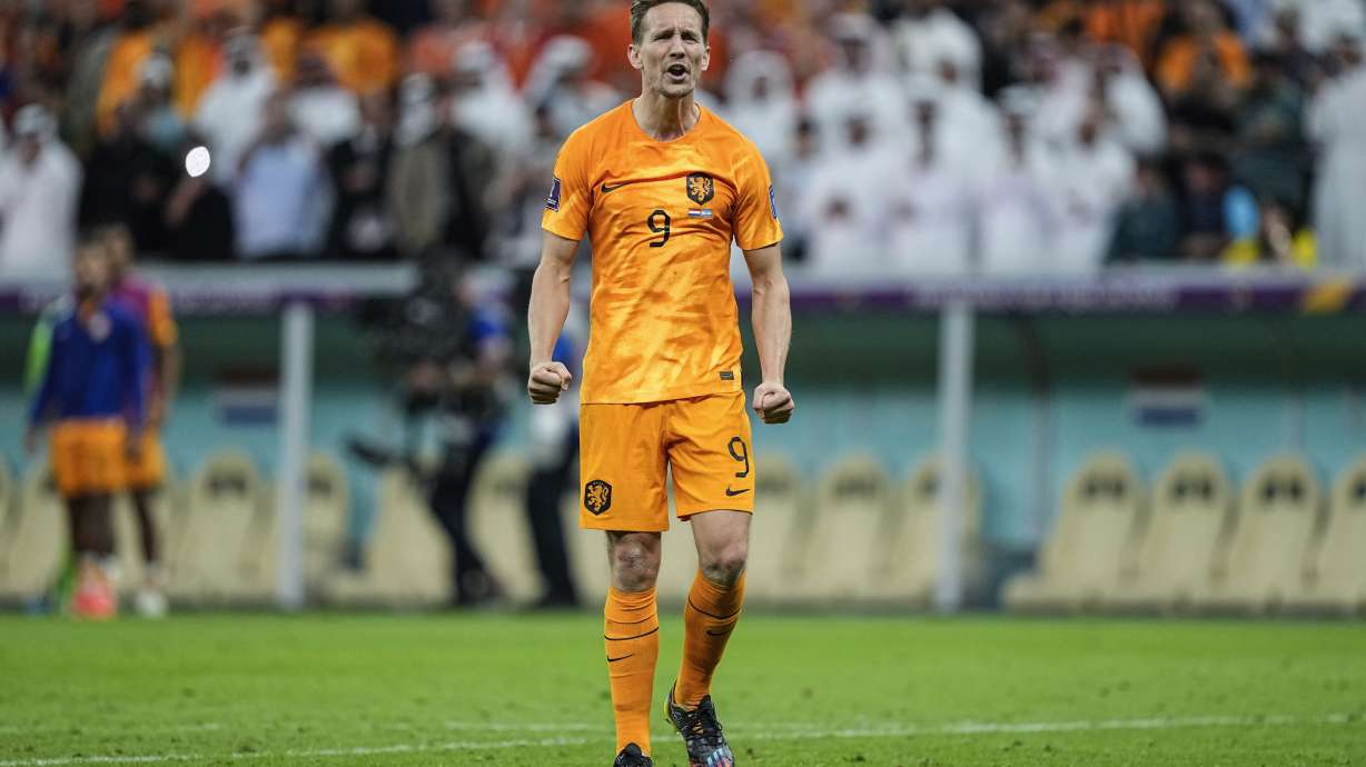 Luuk de Jong of the Netherlands celebrates after scoring a penalty kick during the World Cup quarterfinal soccer match between the Netherlands and Argentina, at the Lusail Stadium in Lusail, Qatar, Saturday Dec. 10, 2022.